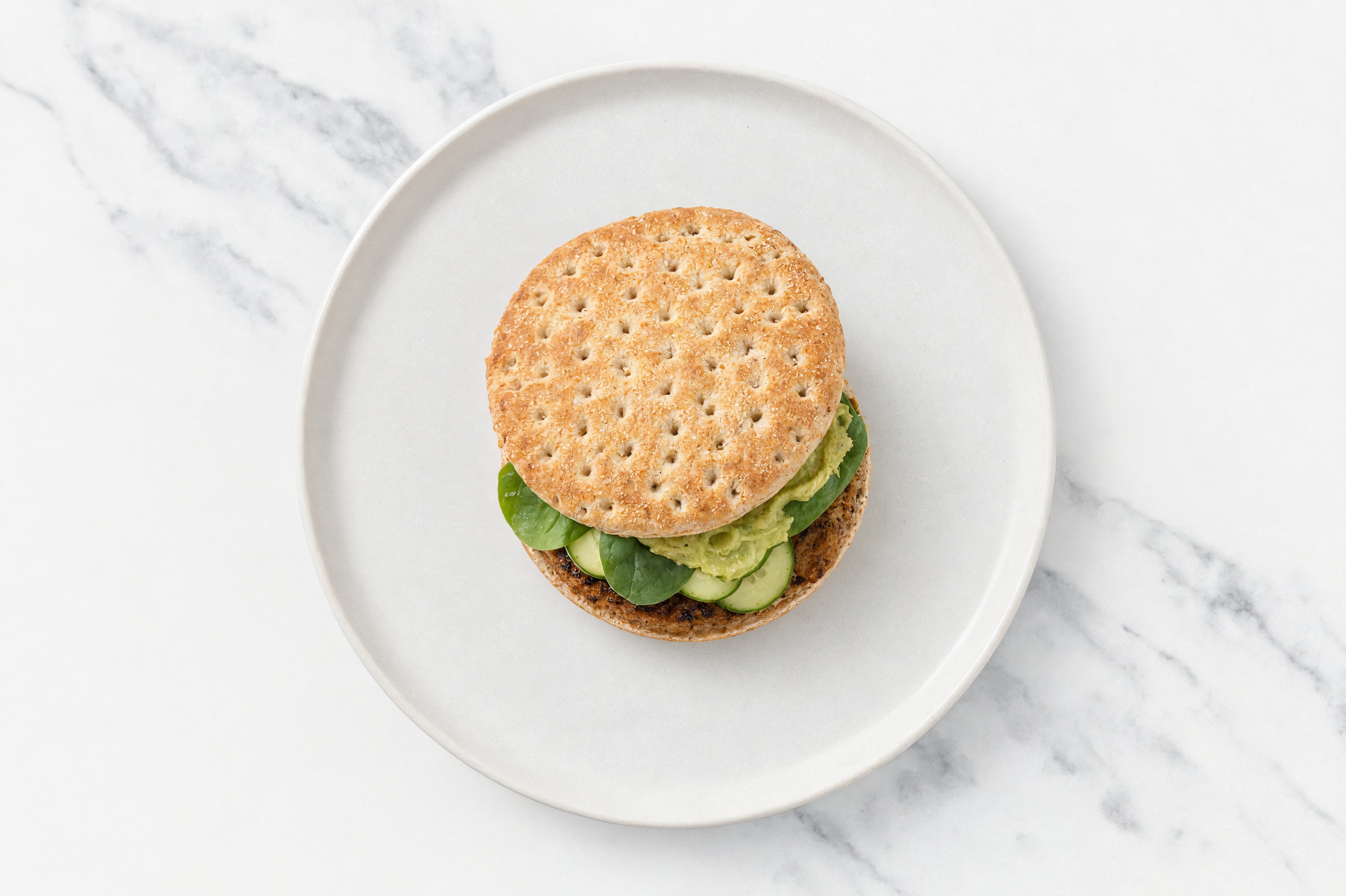Herby Grilled Blackened Beef Guacamole Burger with Baby Spinach