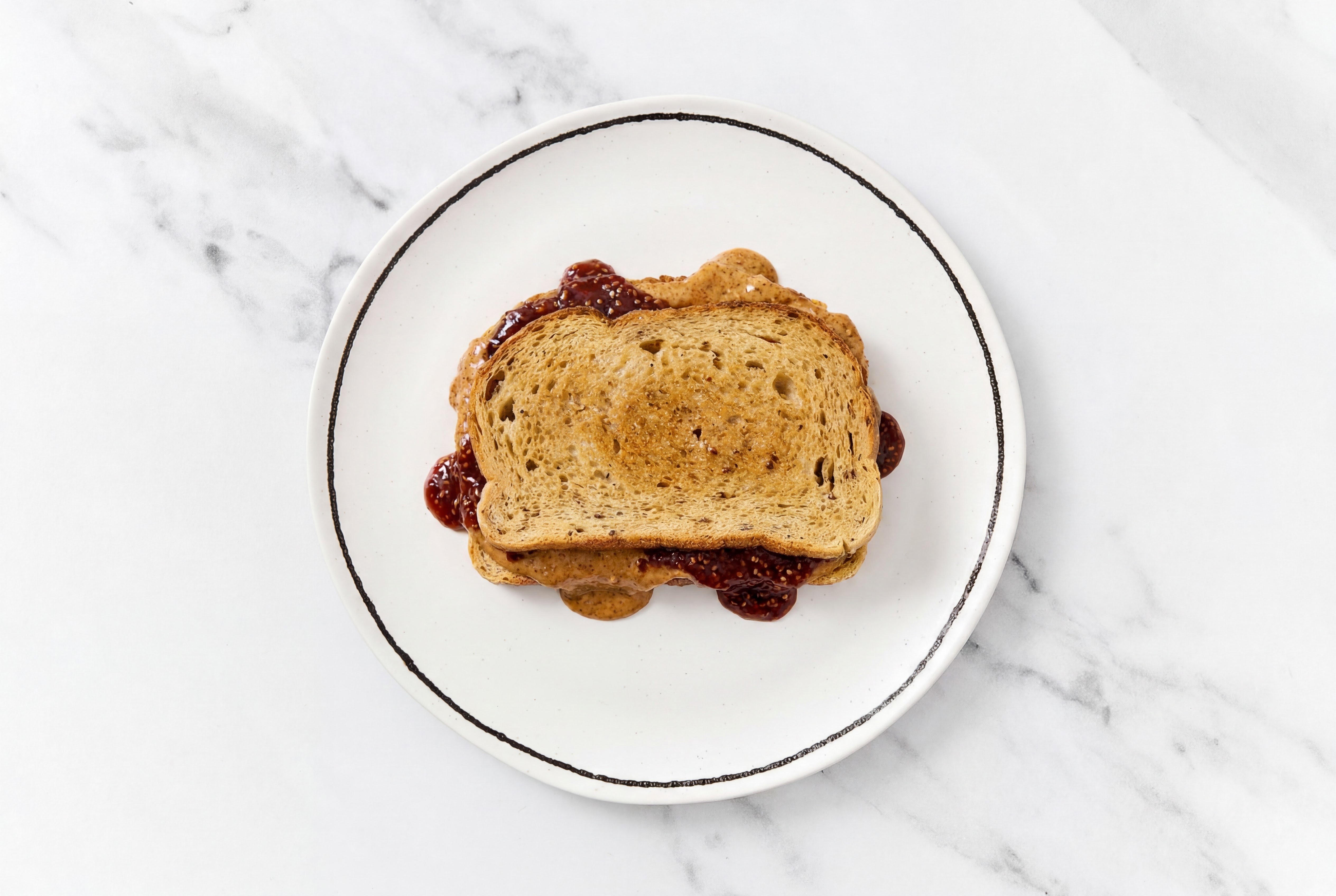 Almond Butter + Strawberry Jam Multigrain Sourdough Sandwich