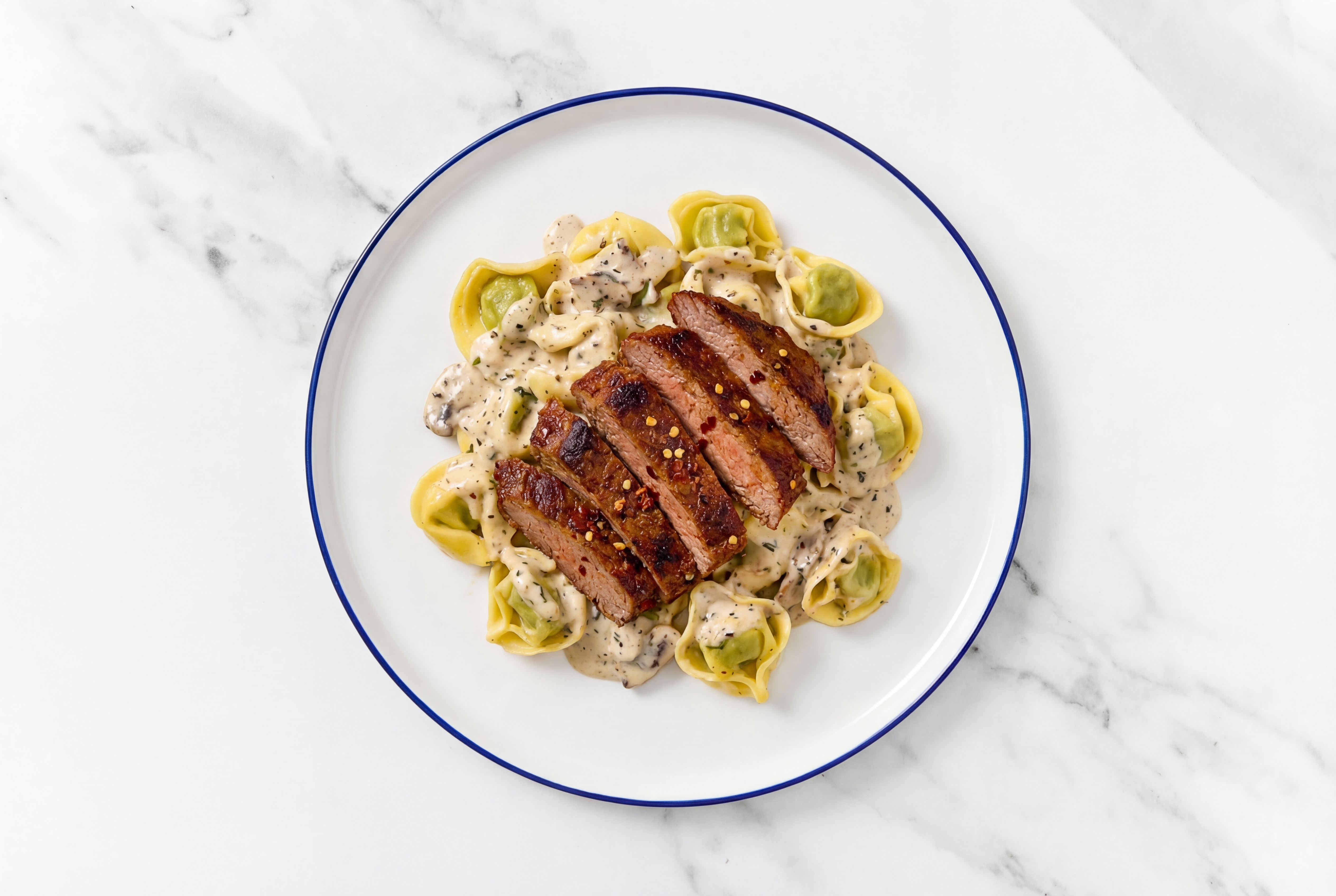 Steakhouse Cheese Tortellini Truffle with Adobo Marinated Flank Steak