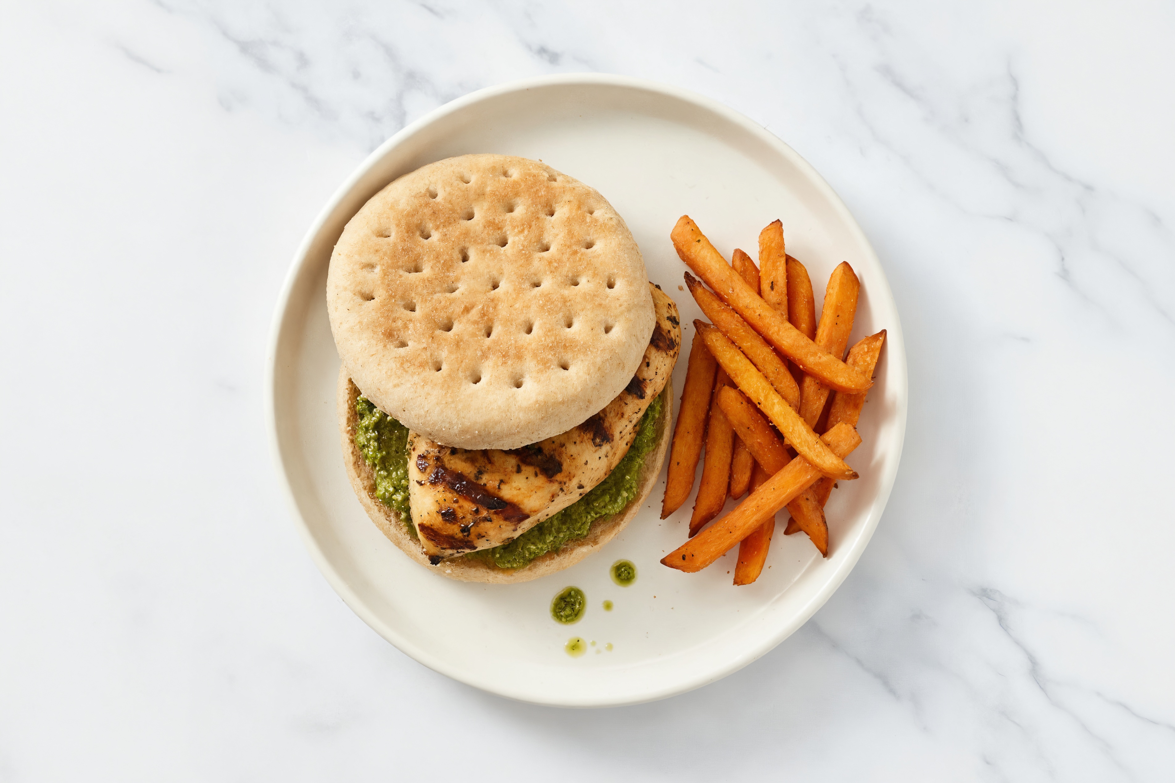 Basil Pesto Mediterranean Grilled Chicken Breast Sandwich with Sweet Potato Fries