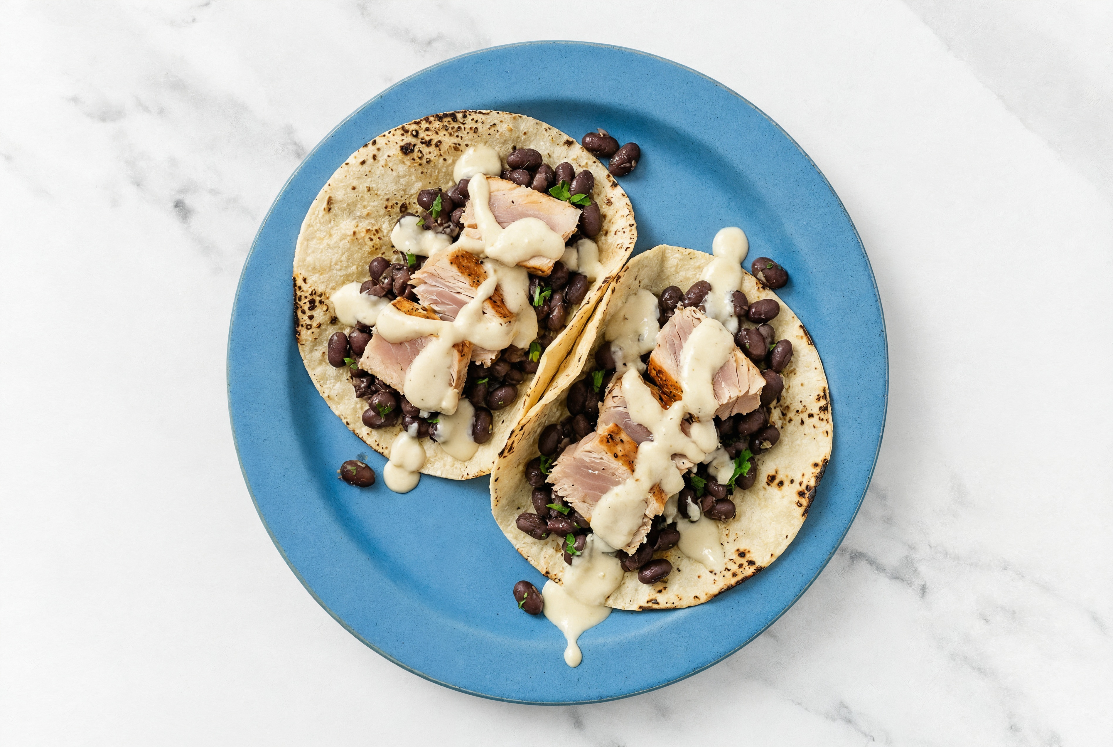 Hearty Cuban Spiced Black Beans Bean Tacos with Seared Tuna & Garlic Sauce