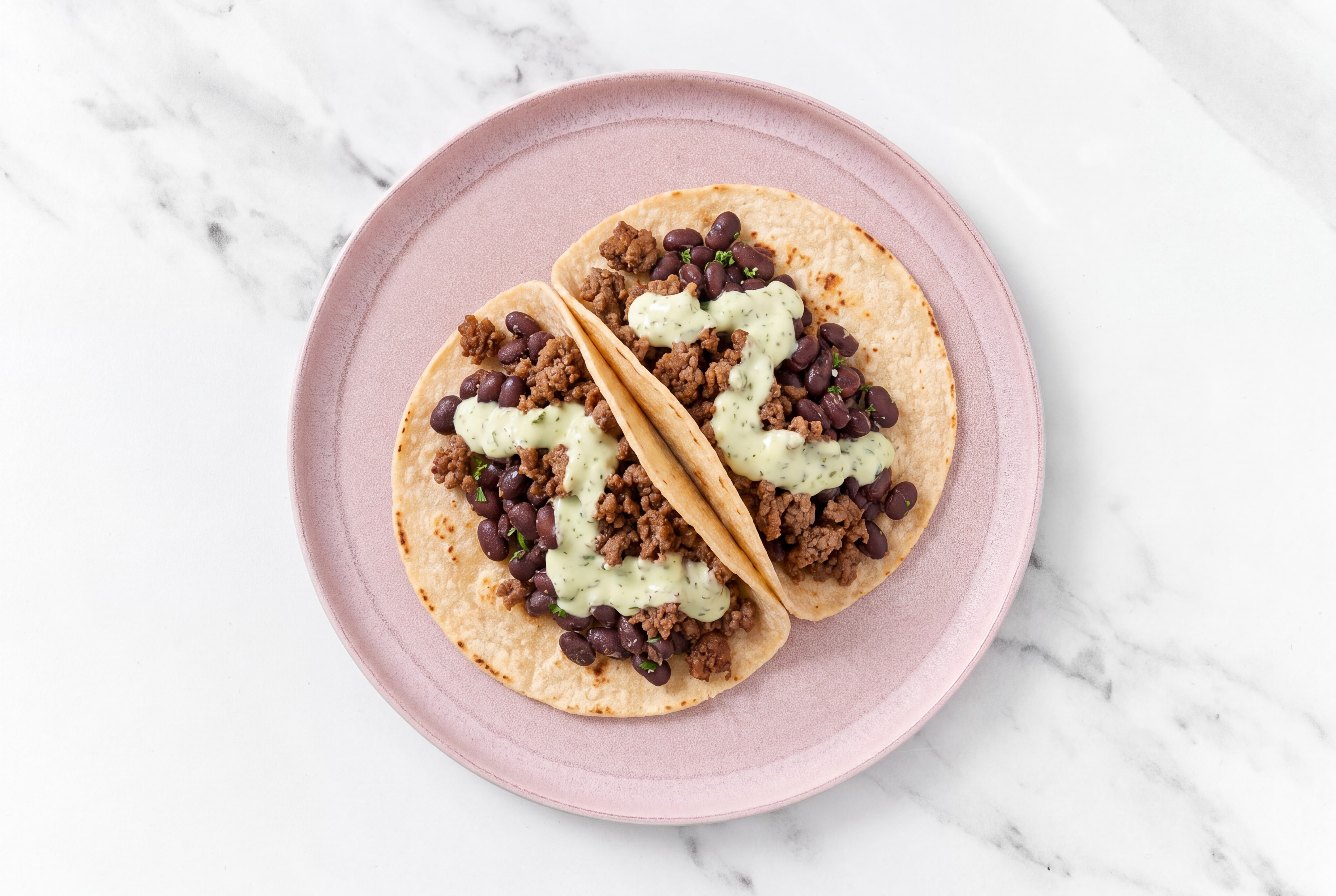 Ground 93/7 Lean Beef Tacos with Jalapeño Crema & Spiced Beans