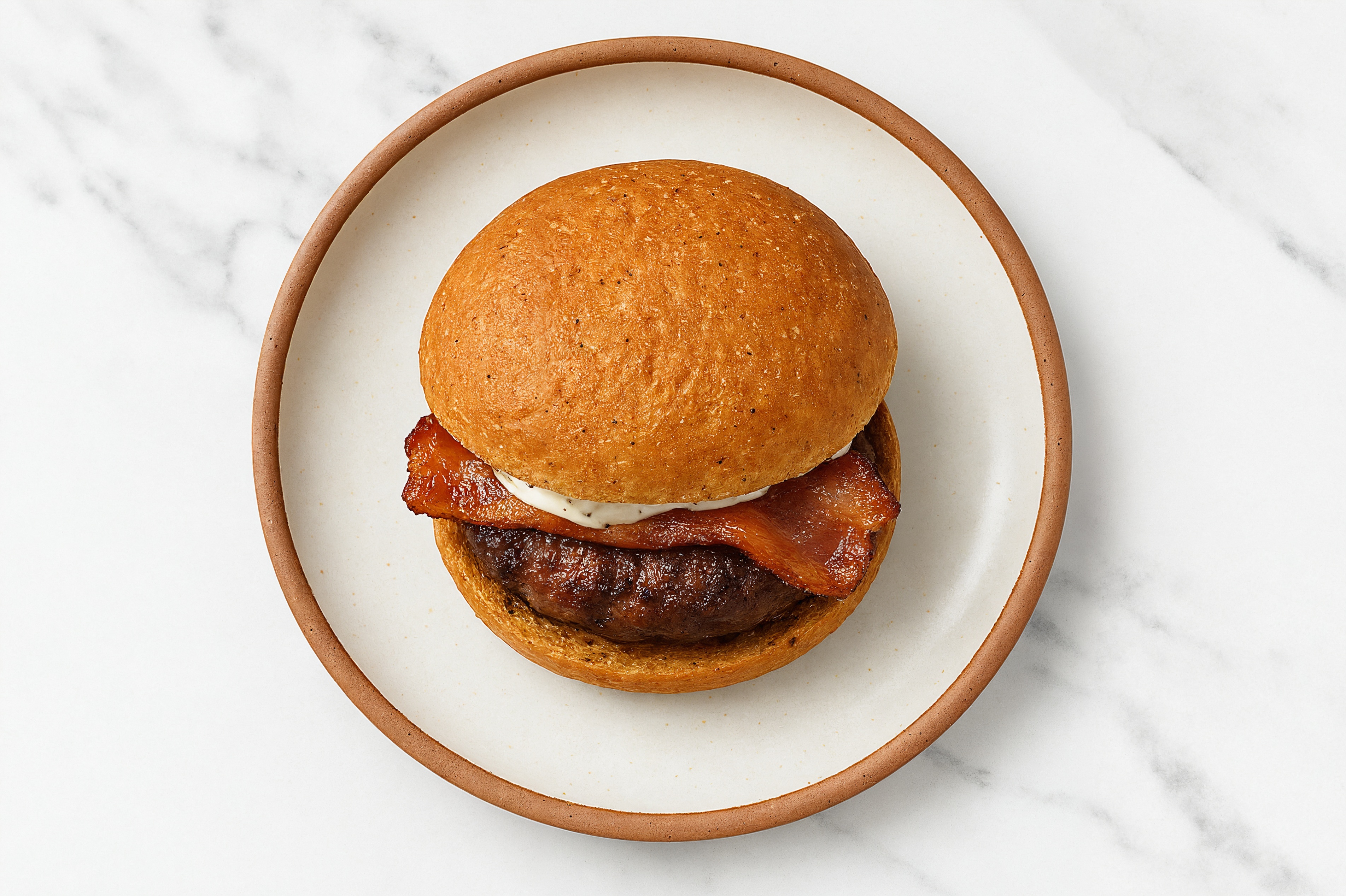 Bison Burger on Sprouted Grain with Tzatziki & Applewood Smoked Pork Bacon