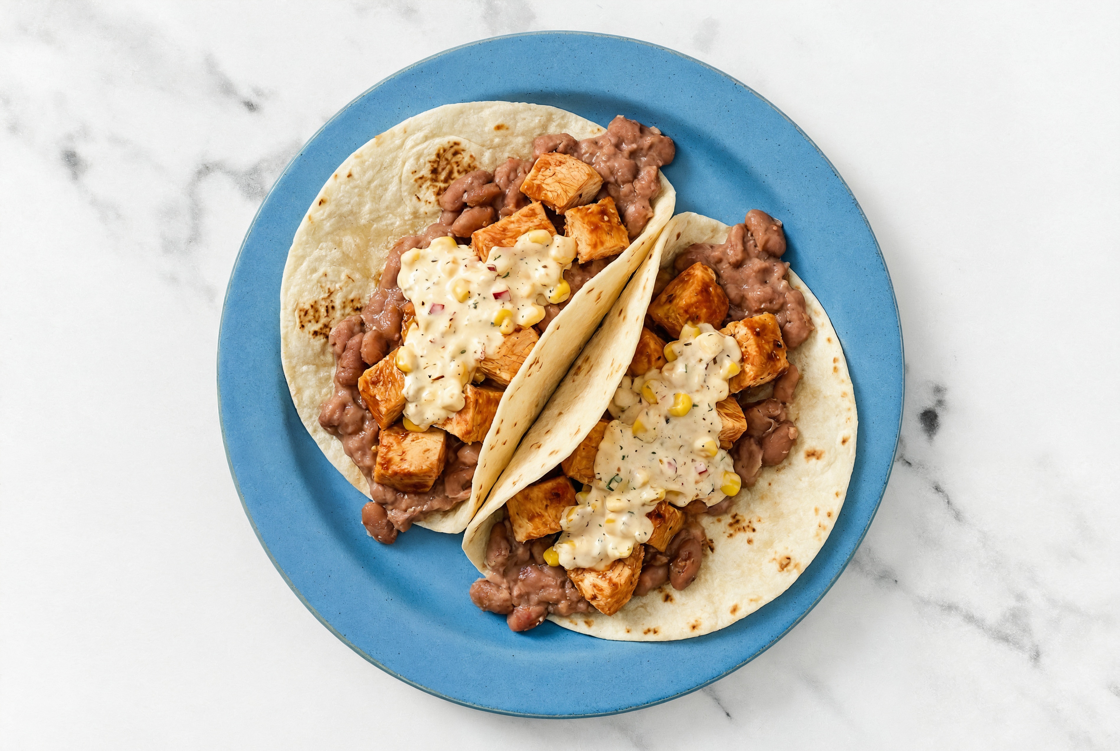 Chipotle Chicken Tacos with Street Corn Sauce & Refried Red Beans