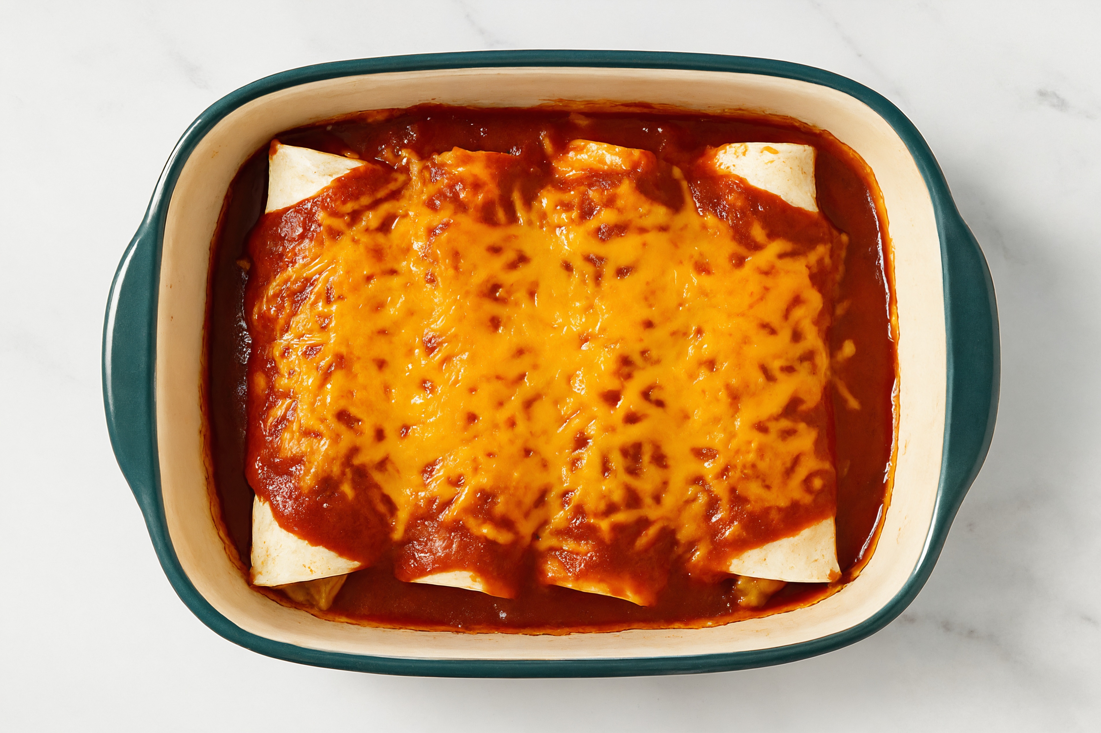 Herby Cheesy Chicken Enchiladas Rojas with Shredded Sharp Cheddar Cheese