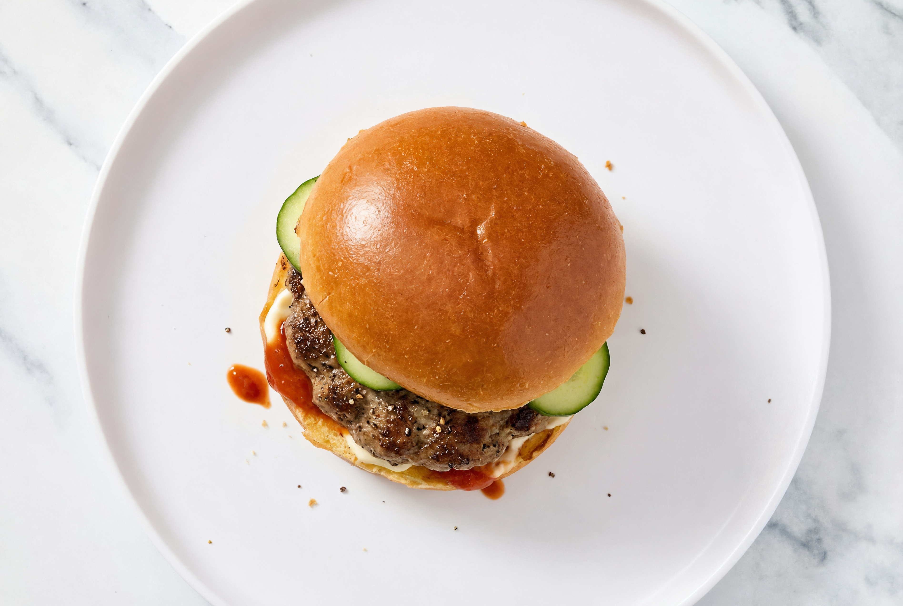 Beef Burger on Brioche with Spicy Mayo + Cucumber with Sriracha Hot Sauce