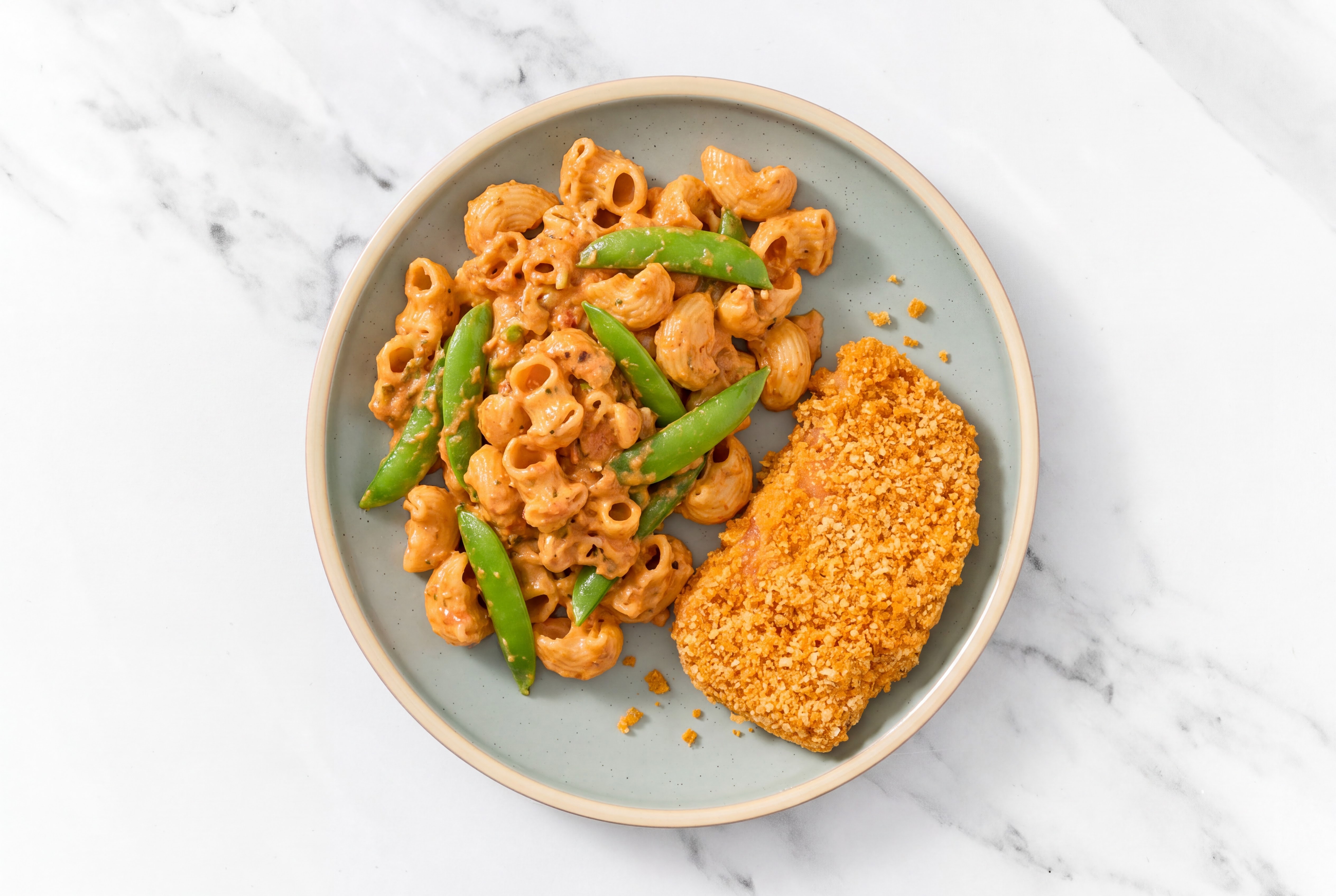 Crispy Hot Honey Chicken over Creamy Vodka Chiocciole Pasta with Snap Peas