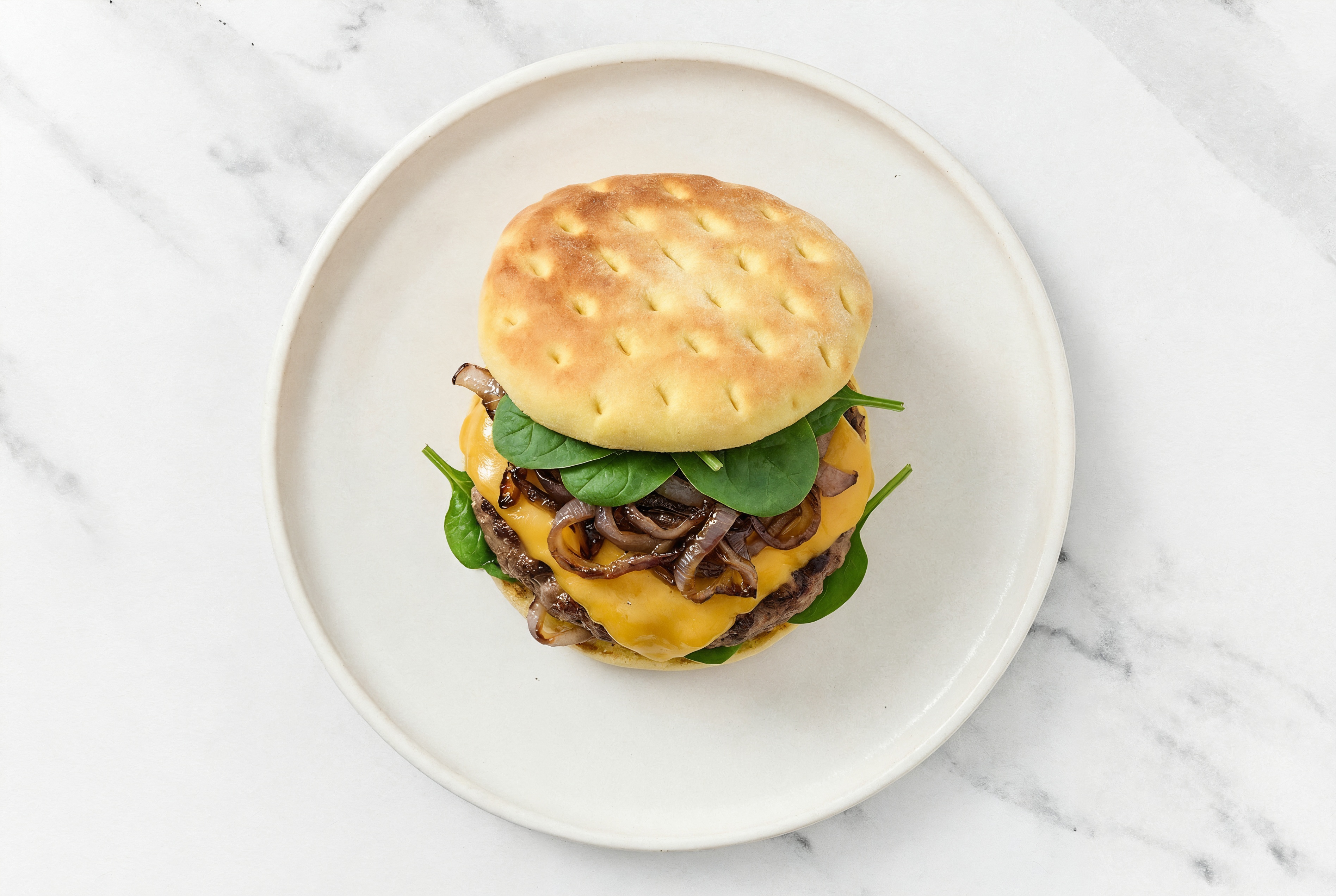 Multigrain Grass-Fed Cheeseburger with Sautéed Onions with Ground Beef Patties