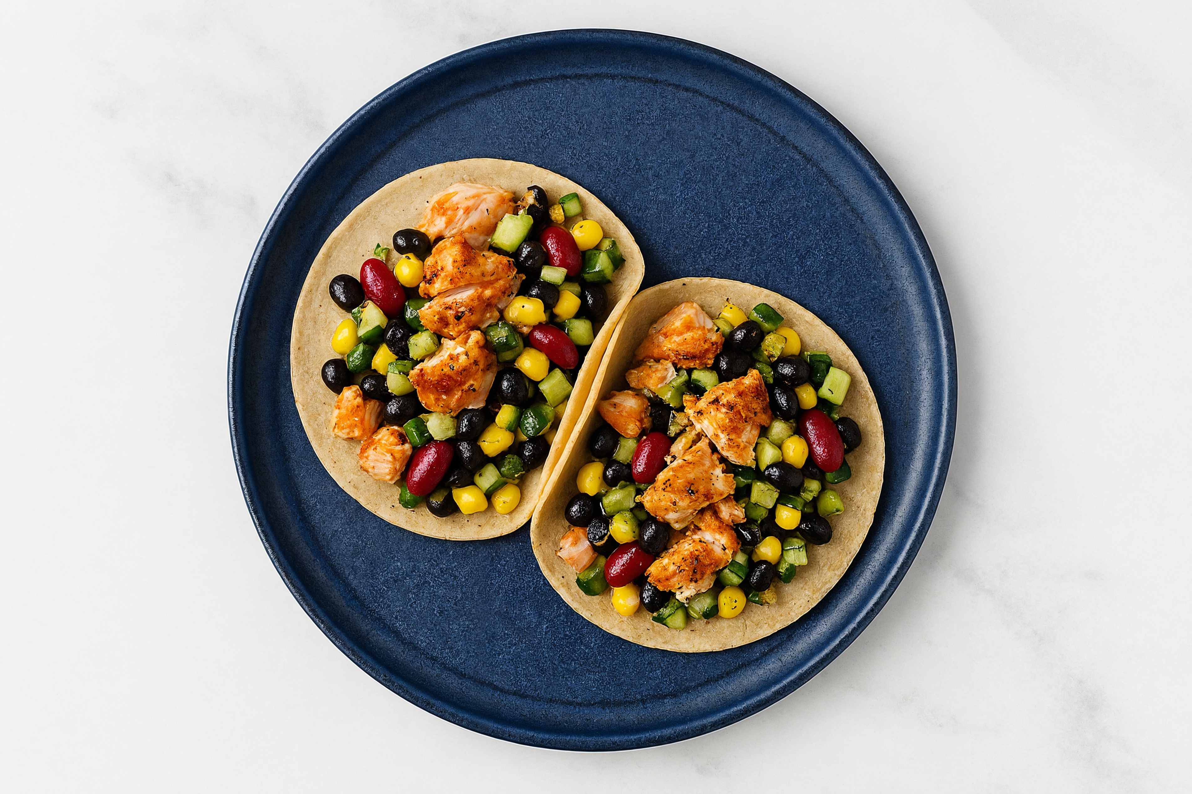 Salmon Tacos with Cucumber Corn Salad