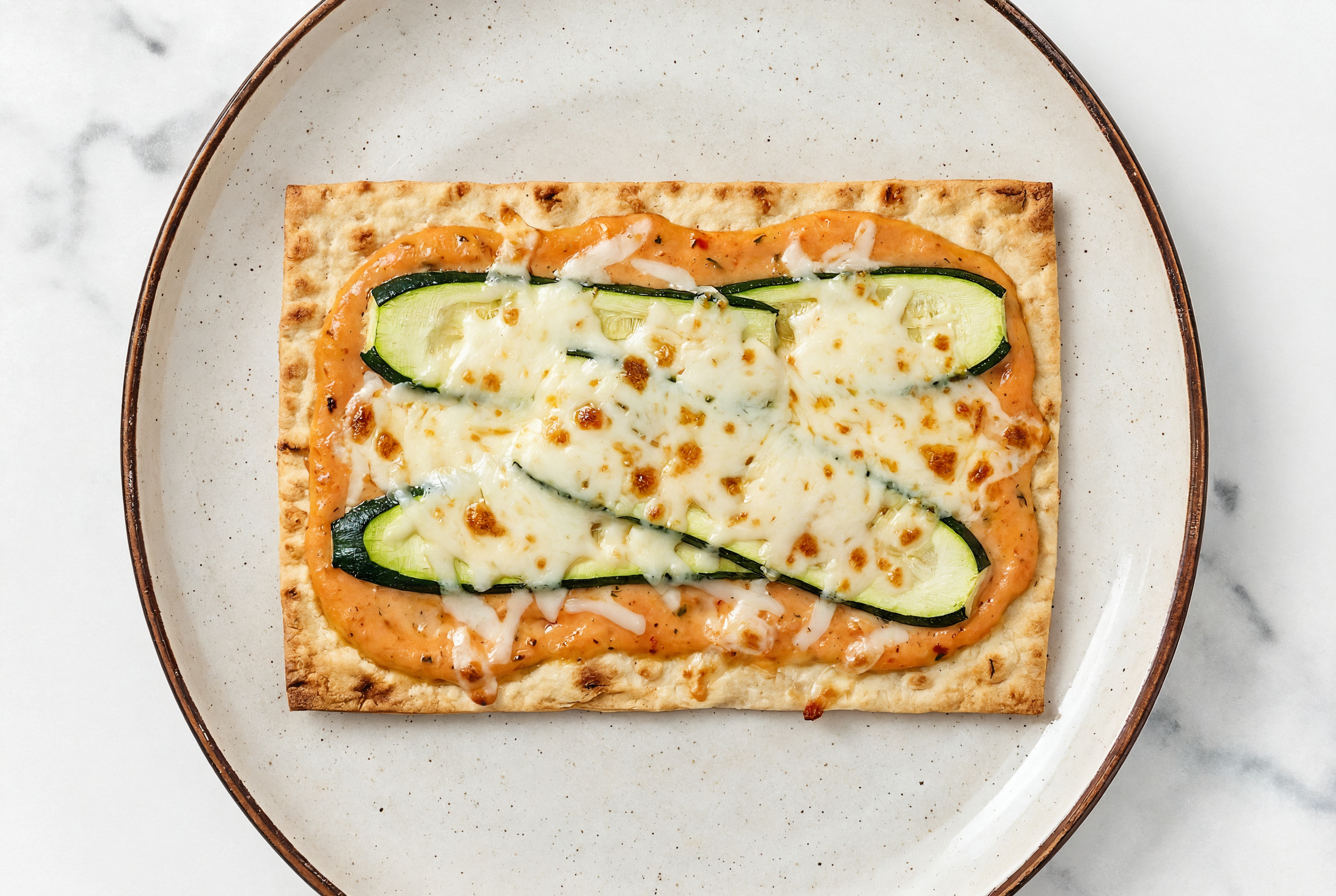 Savory Zucchini Vodka Lavash Pizza with Shredded Mozzarella Cheese
