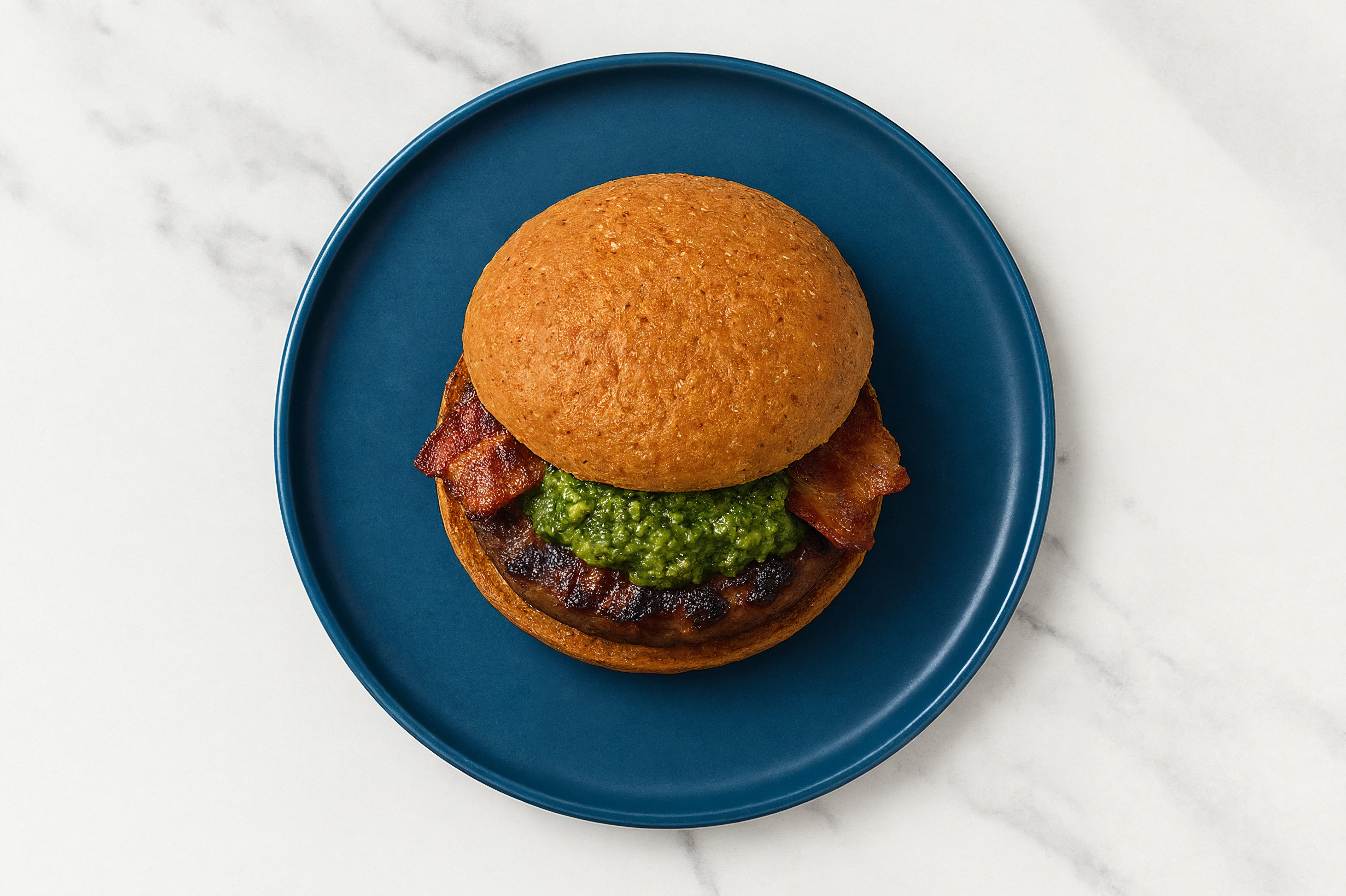 Beef Burger on Sprouted Grain with Spinach Pesto & Applewood Smoked Pork Bacon