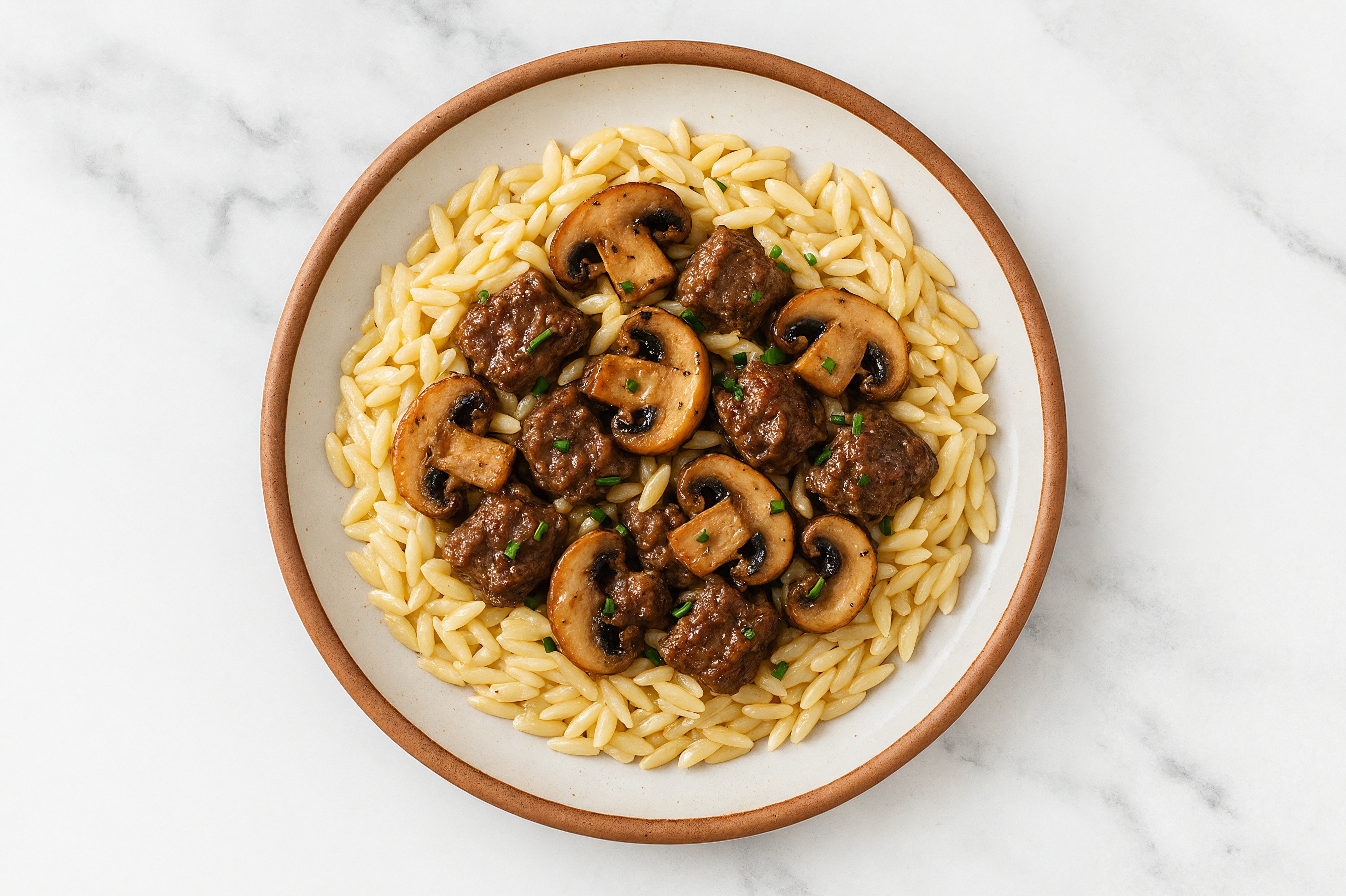 Ground Beef + Orzo with Baby Bellas, Cashew Parm + Chives