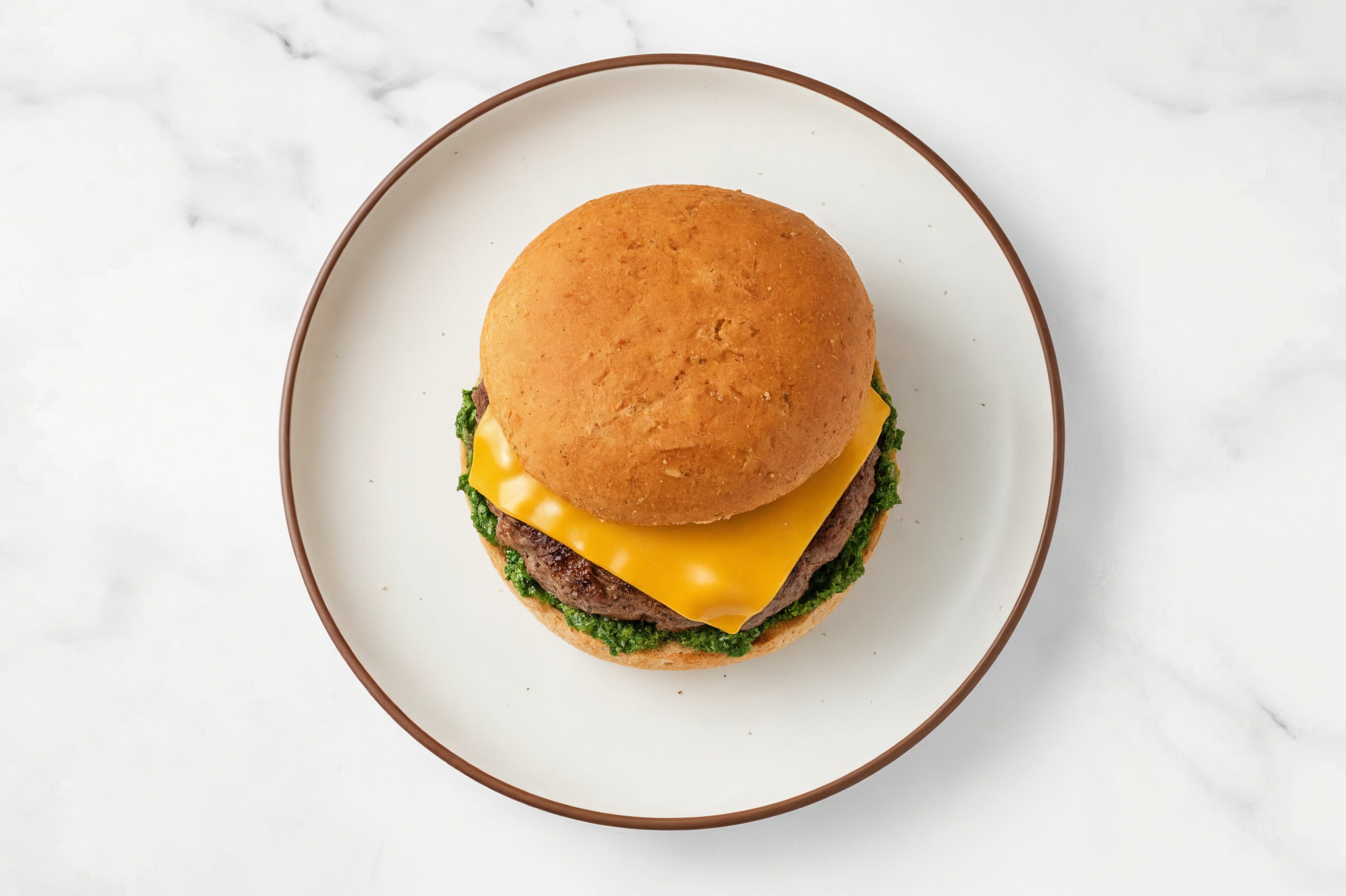 Bison Burger on Sprouted Grain with Spinach Pesto & Cheddar