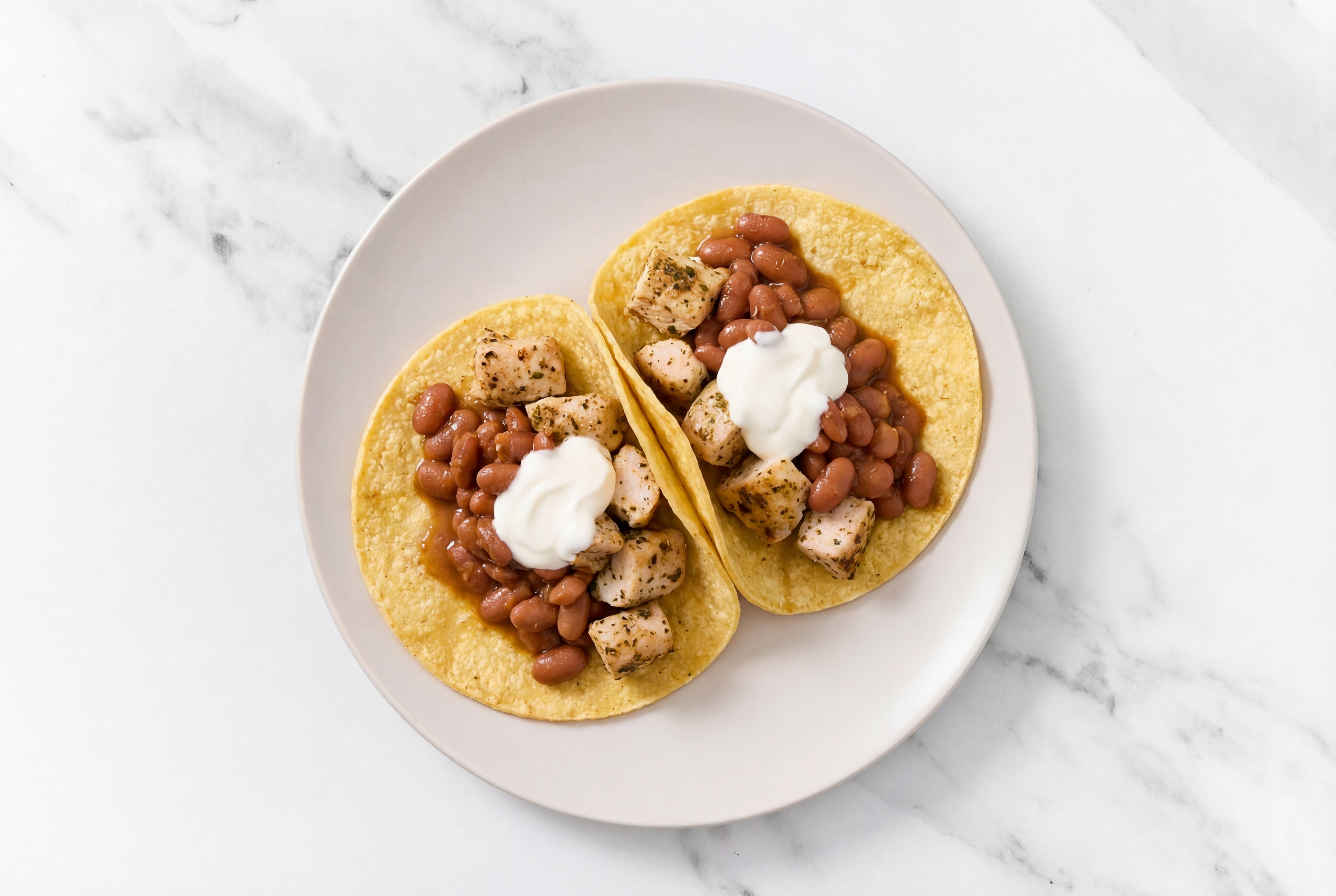 Herby Garlic Chicken Tacos with Crema & Pinto Beans