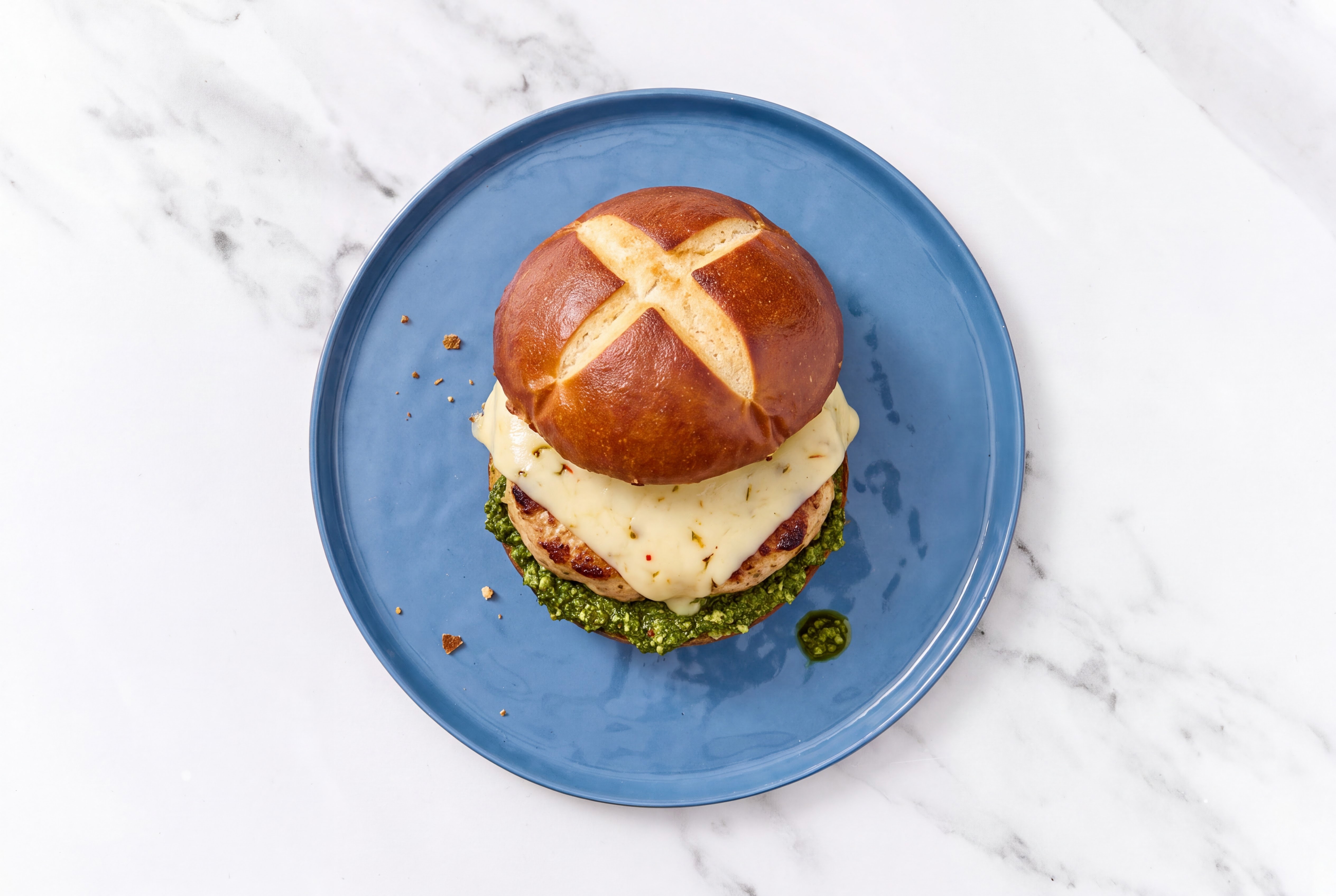 Garlic Turkey Burger on Pretzel with Spinach Pesto & Pepper Jack