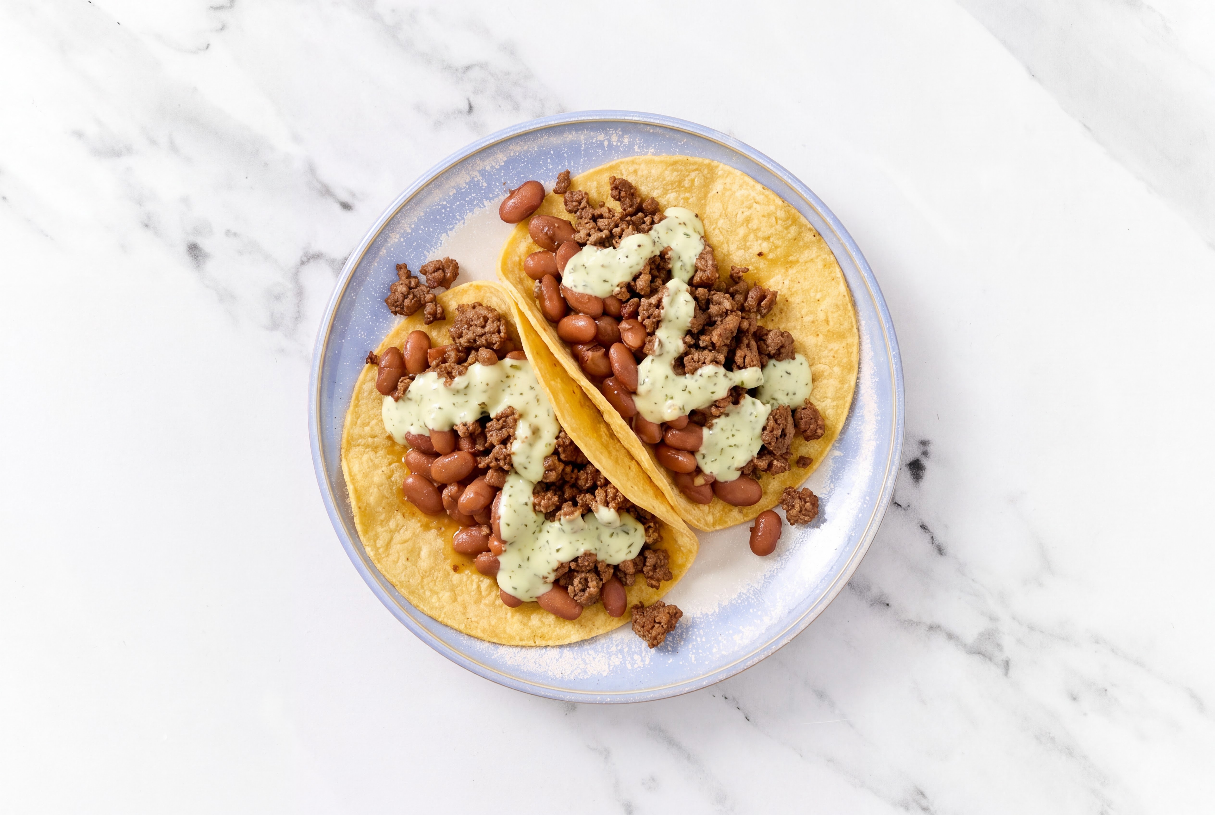 Herby Ground 93/7 Lean Beef Tacos with Jalapeño Crema & Pinto Beans