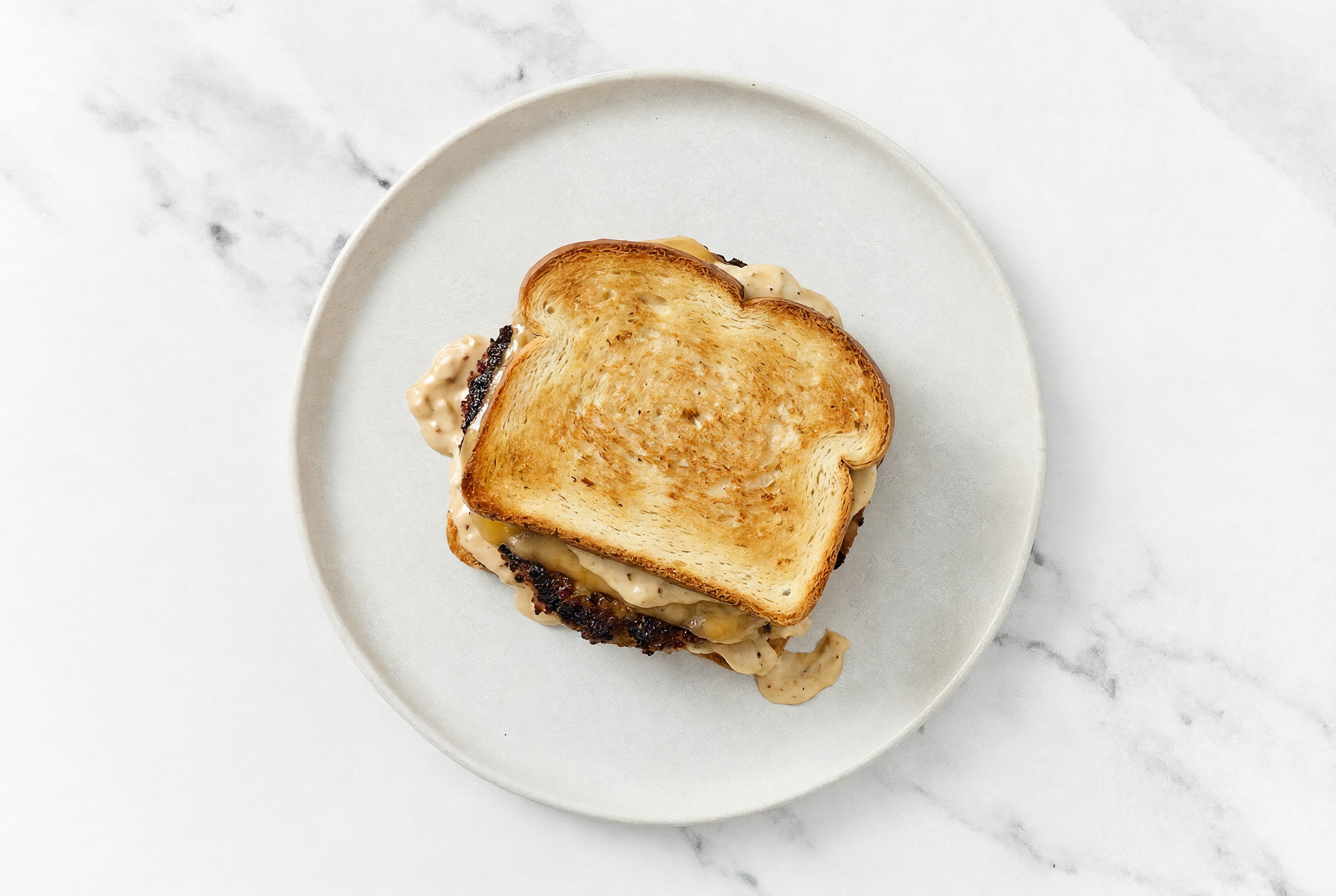 Gouda Beyond Burger on GF Bread with French Onion Sauce
