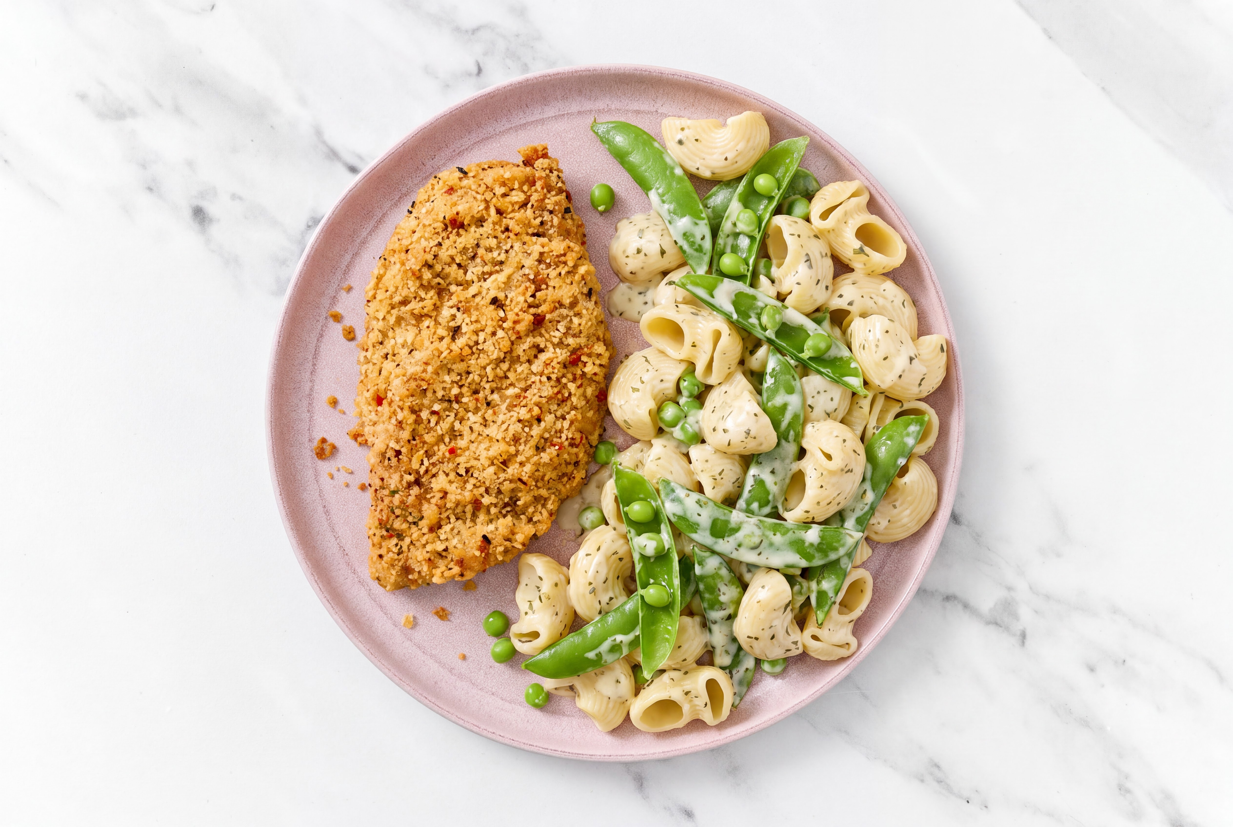 Crispy Garlic Chicken over Creamy Chiocciole Pasta with Snap Peas