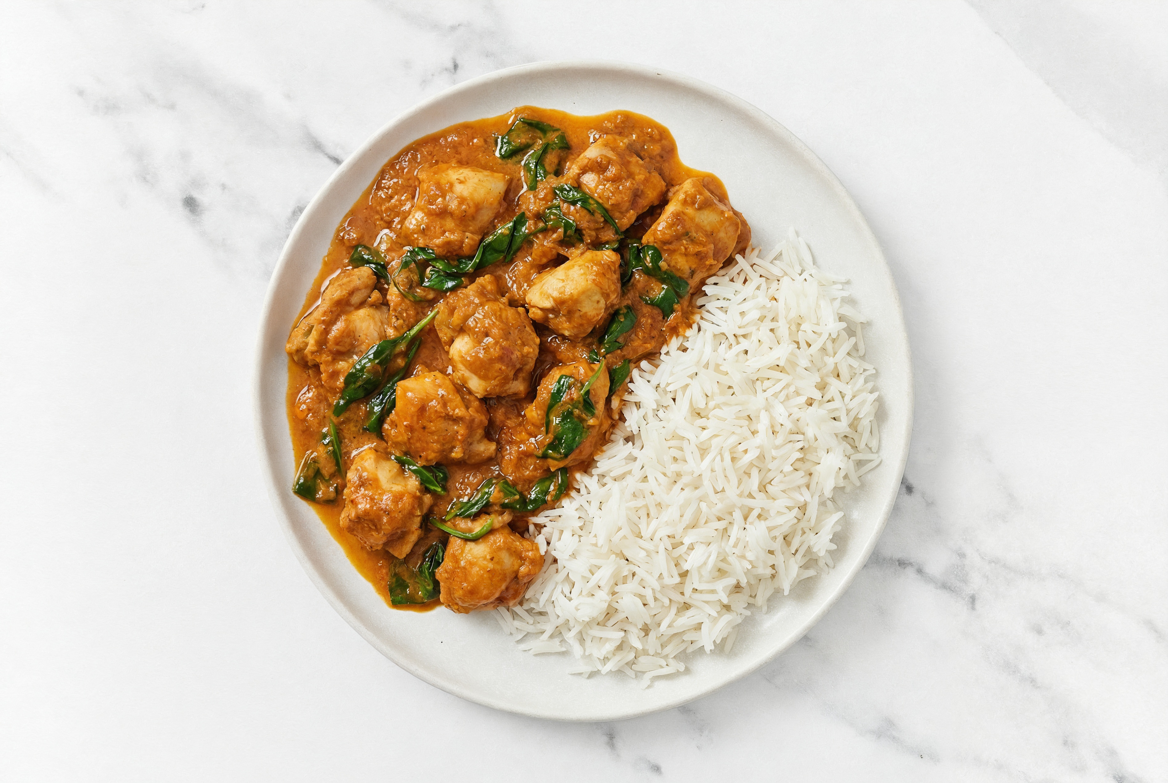 Creamy Chicken Tikka Masala with Rice + Sautéed Baby Spinach