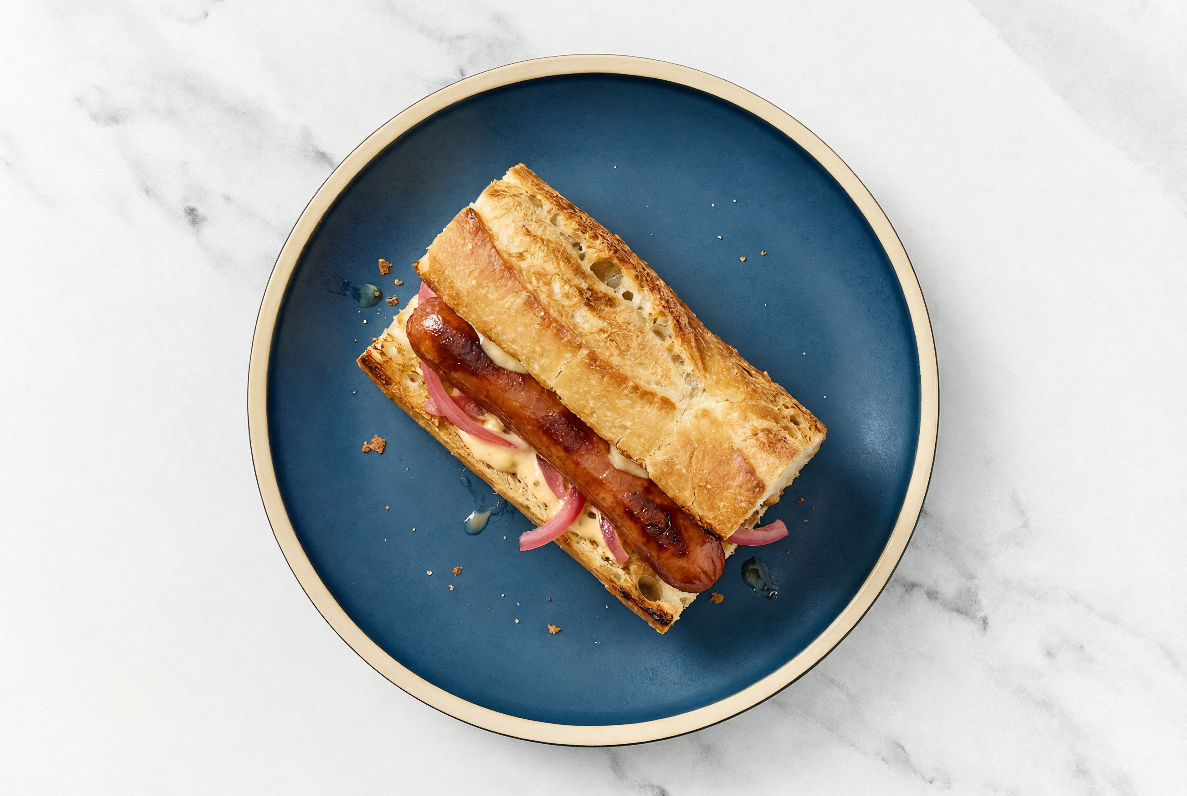 Pickled Red Onion Beef Hot Dog with Awesome Sauce on Baguette