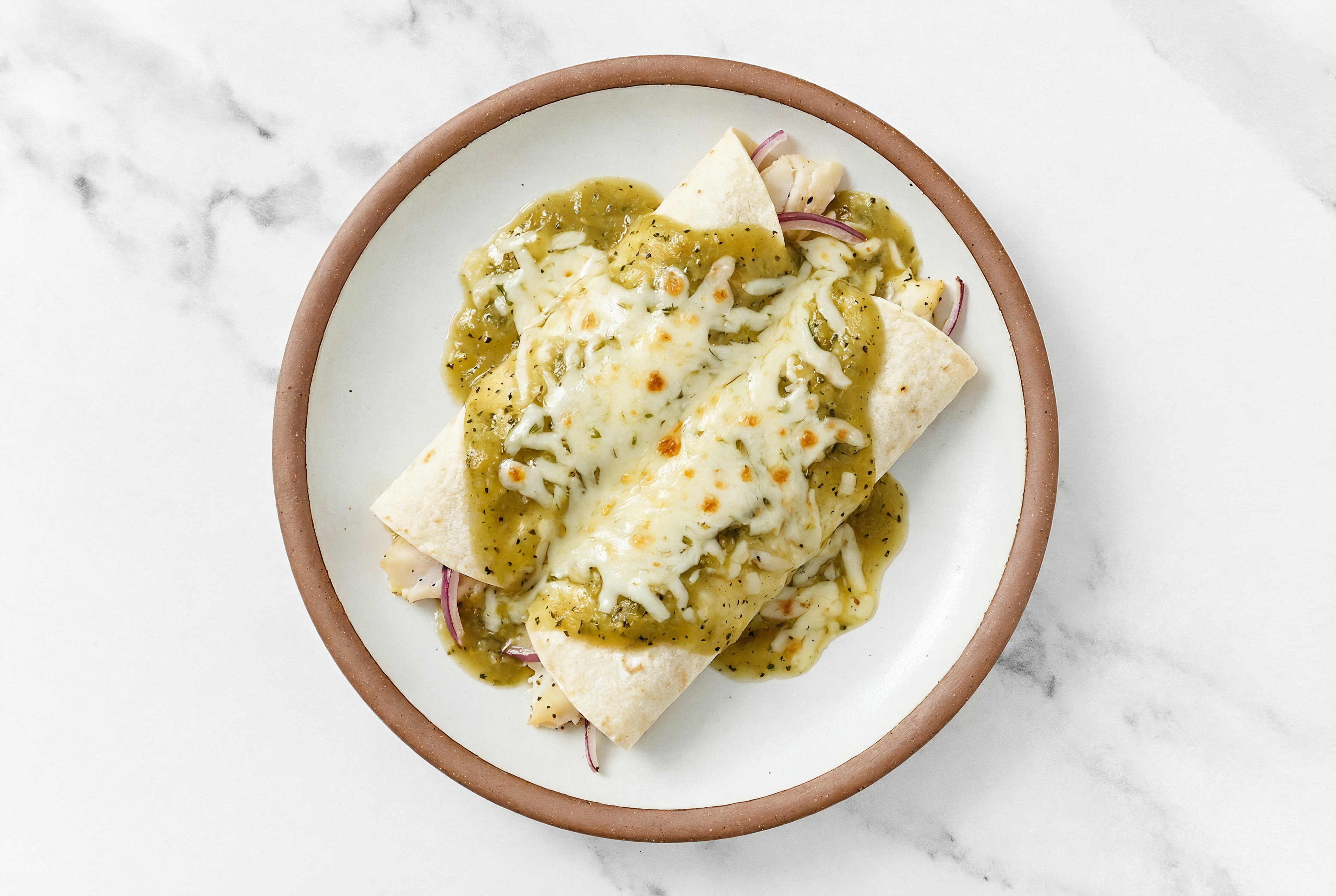 Green Chile Wild Cod Enchiladas with Shredded Mozzarella Cheese
