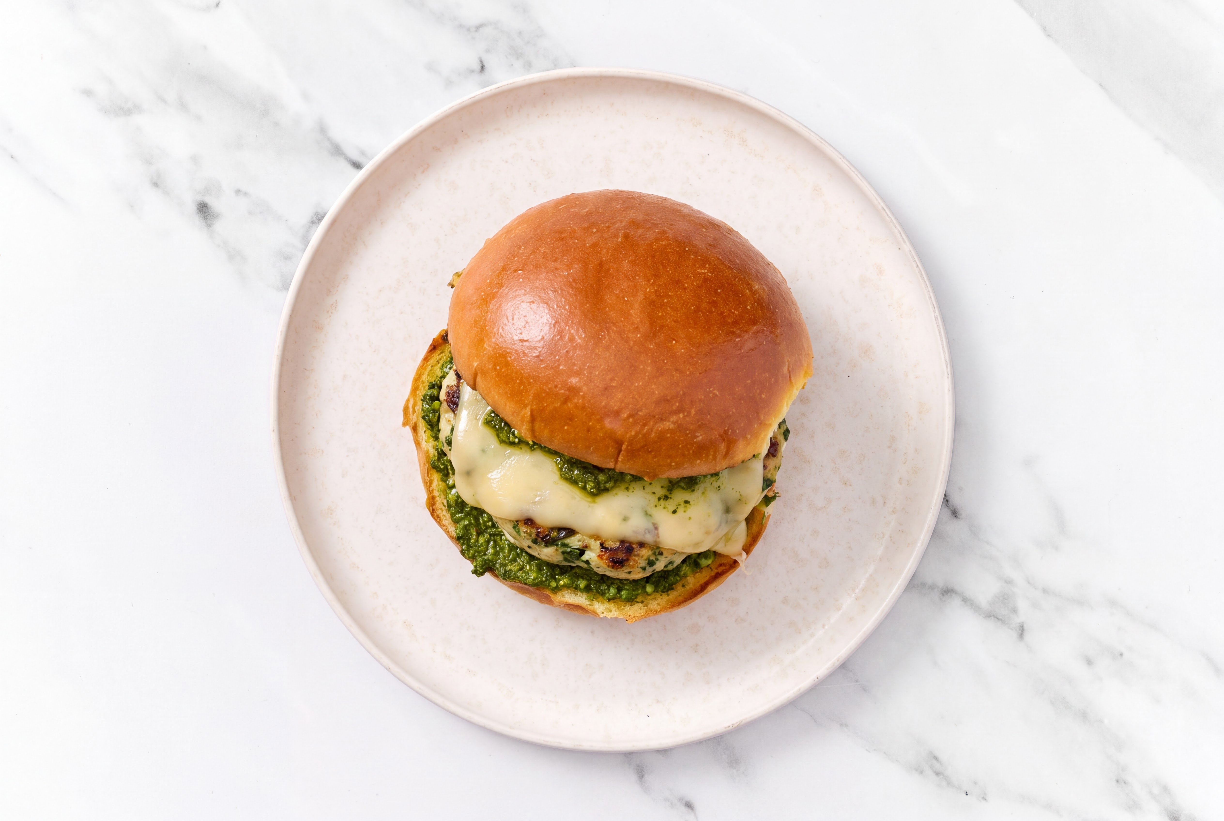 Garlic Turkey Burger on Brioche with Spinach Pesto & Gouda