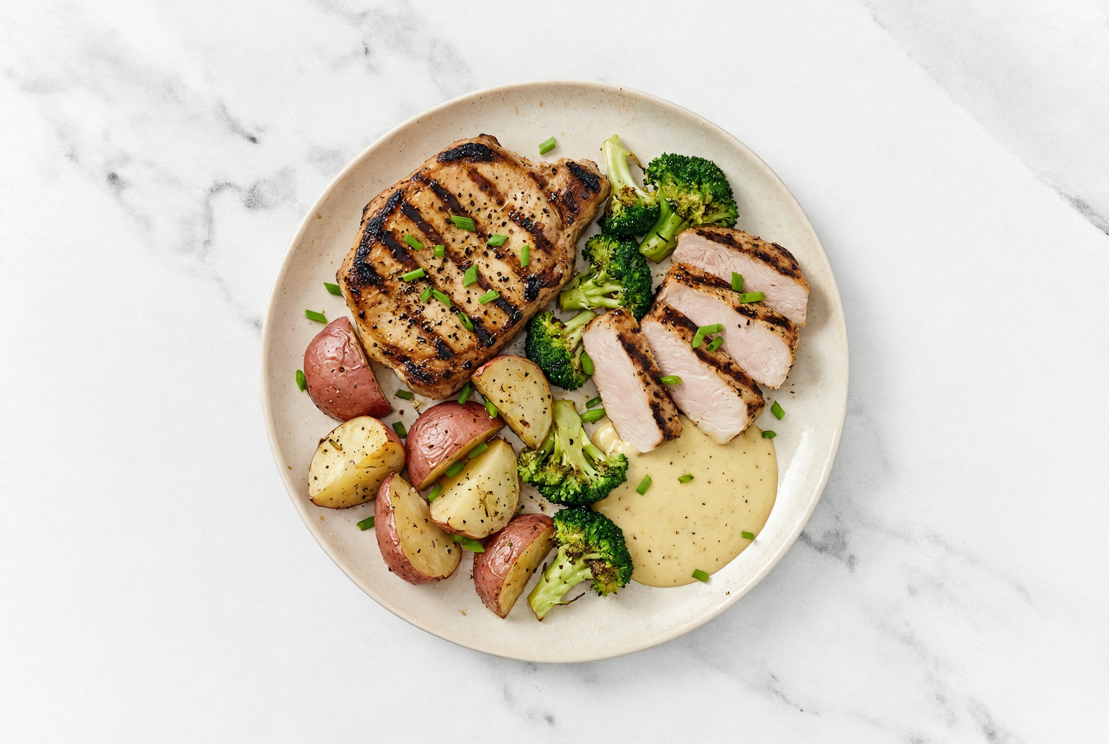 Grilled Pork Chops + Red Potatoes, Chives, Honey Mustard Sauce + Organic Broccoli