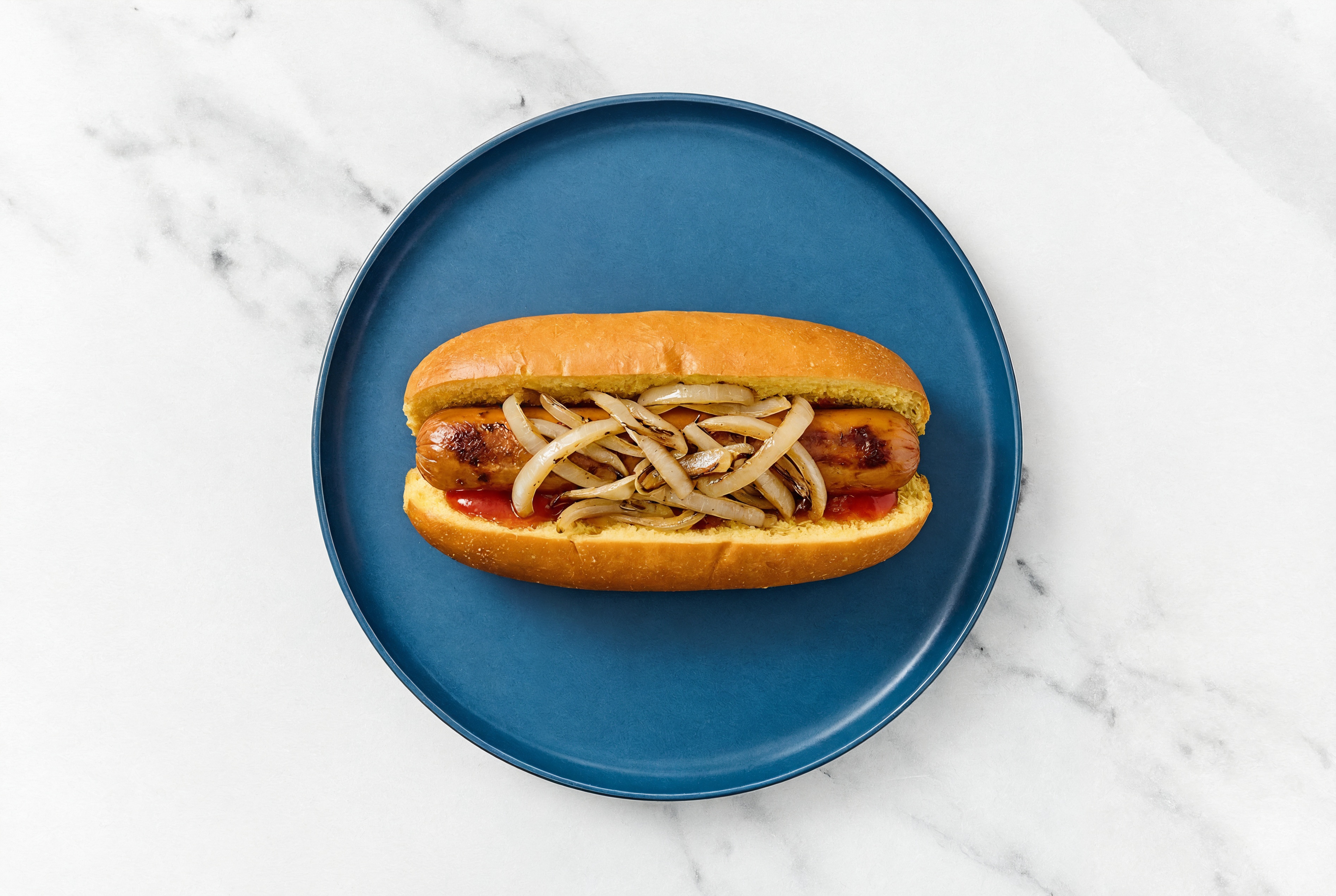 Carmelized Onion Smart Dog with Ketchup on Brioche