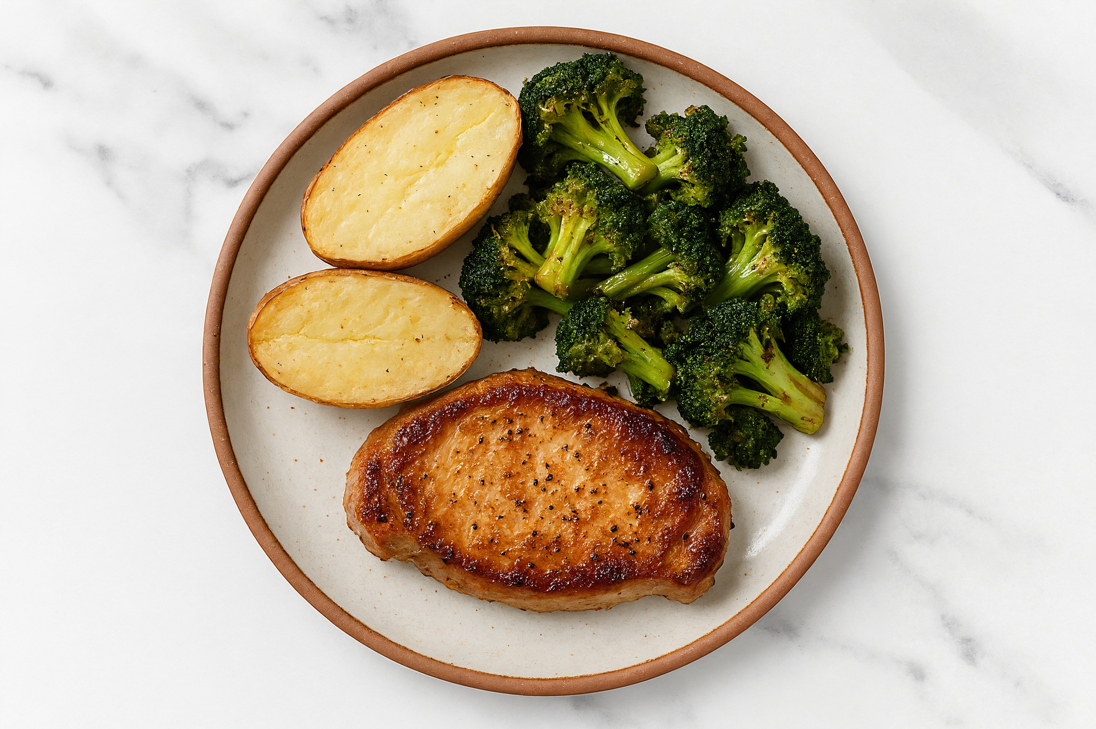 Seared Pork Chop with Baked Microwave-Ready Russet Potato + Organic Broccoli