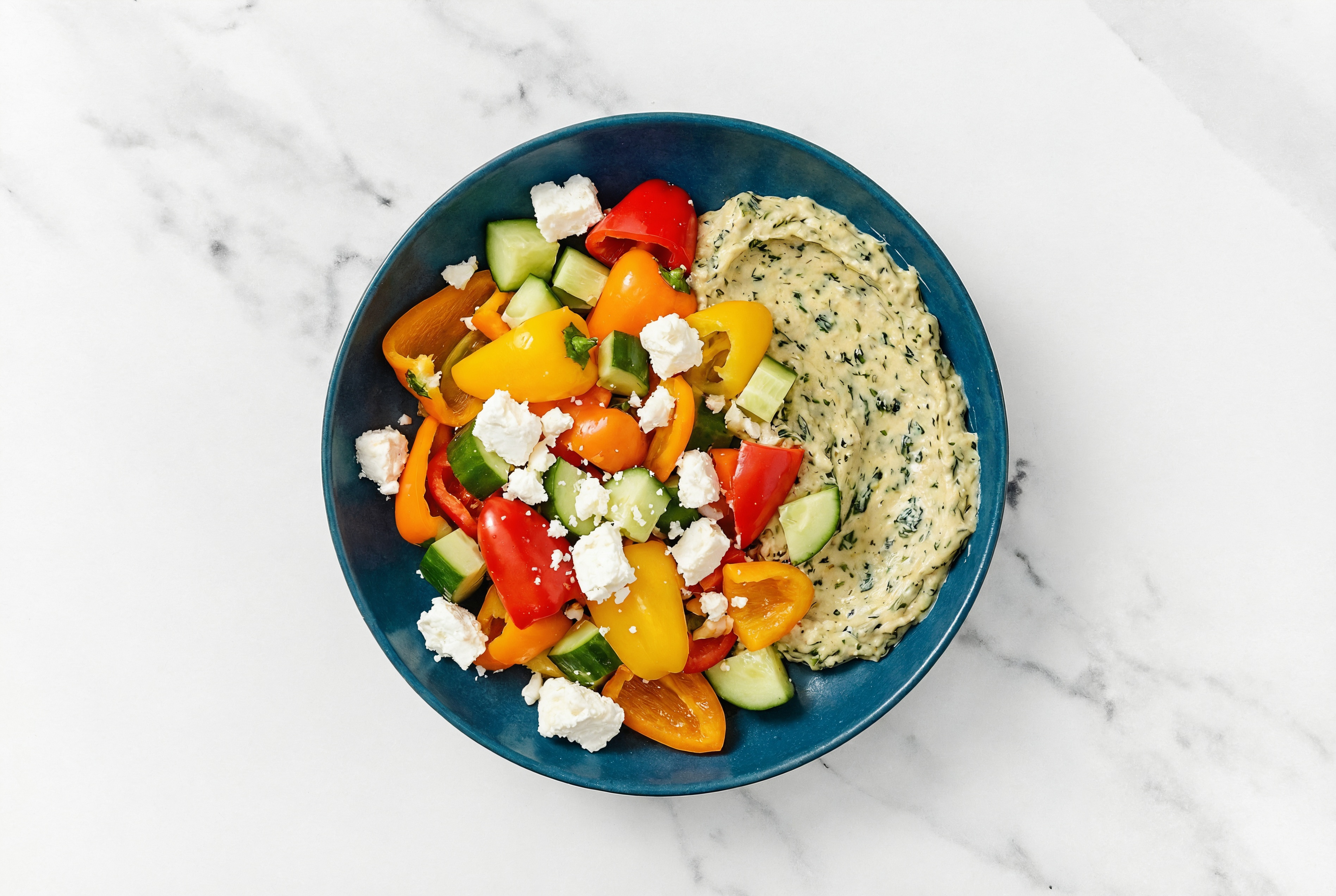 Feta Sweet Pepper Cucumber Bowl over Spinach Artichoke Dip