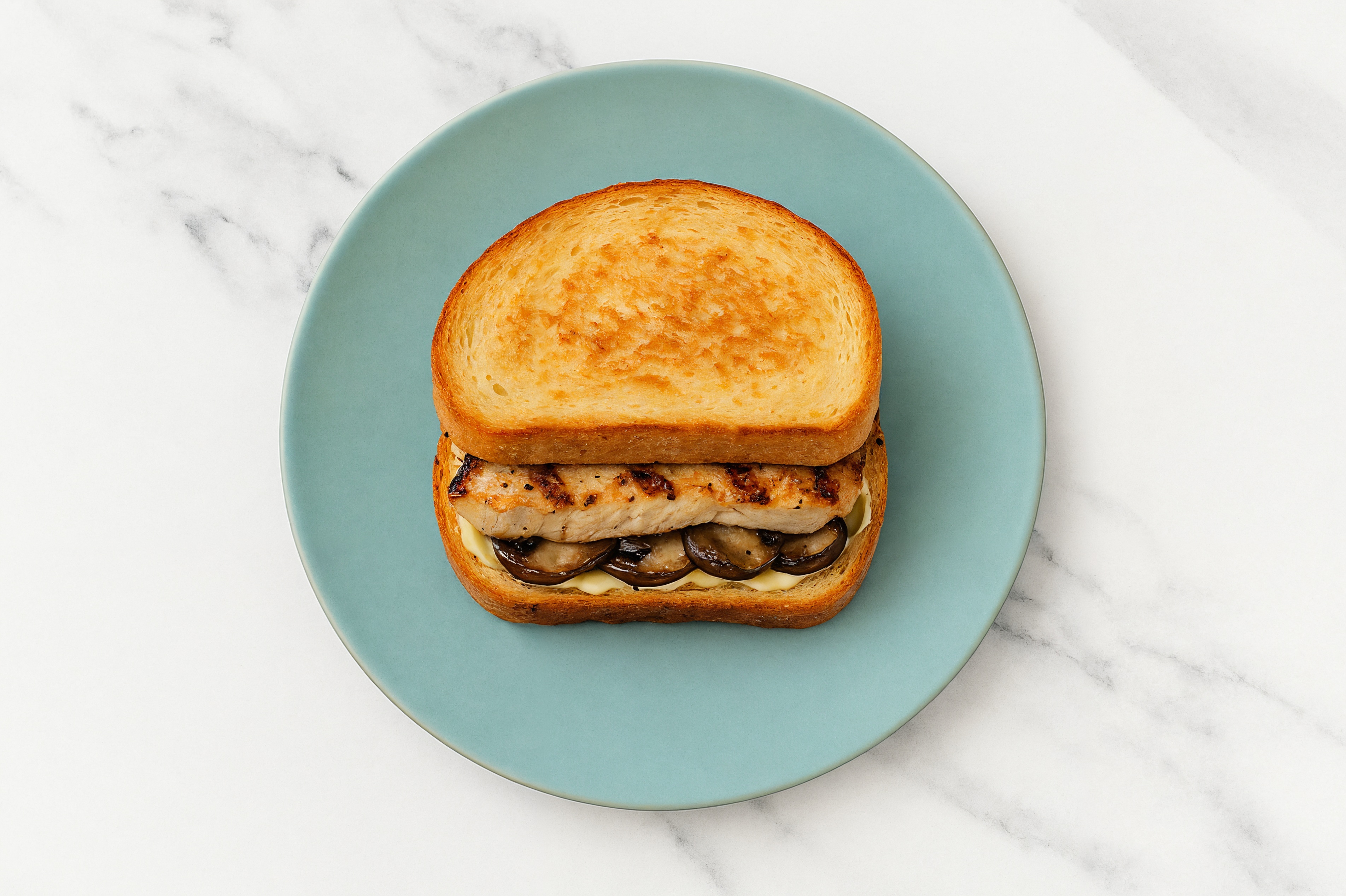 Creamy Horseradish Grilled Pork Sandwich with Portabellas on Honey White Bread