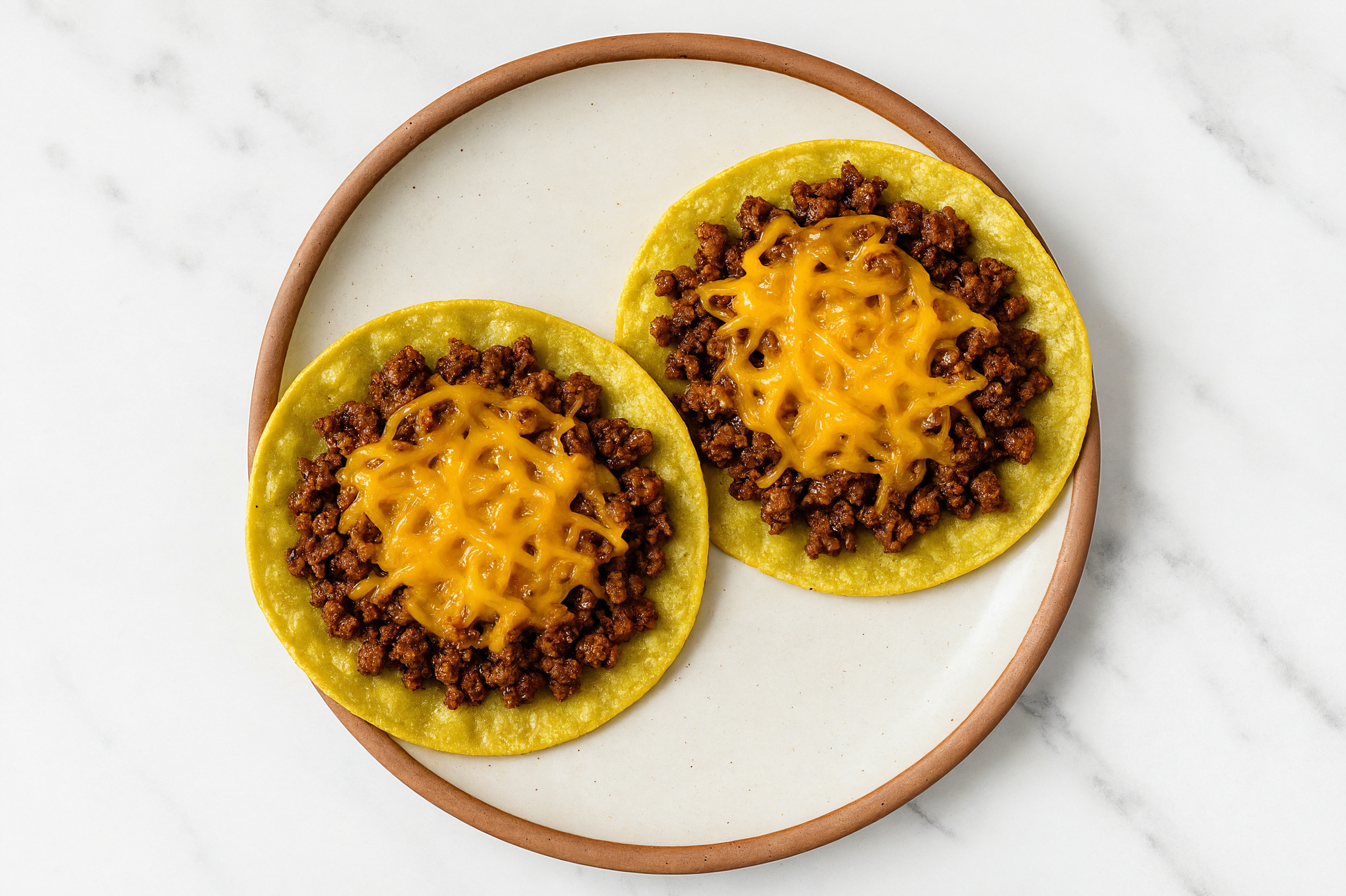 Tex-Mex Wagyu Beef 'n Cheese Tostada with Shredded Sharp Cheddar Cheese