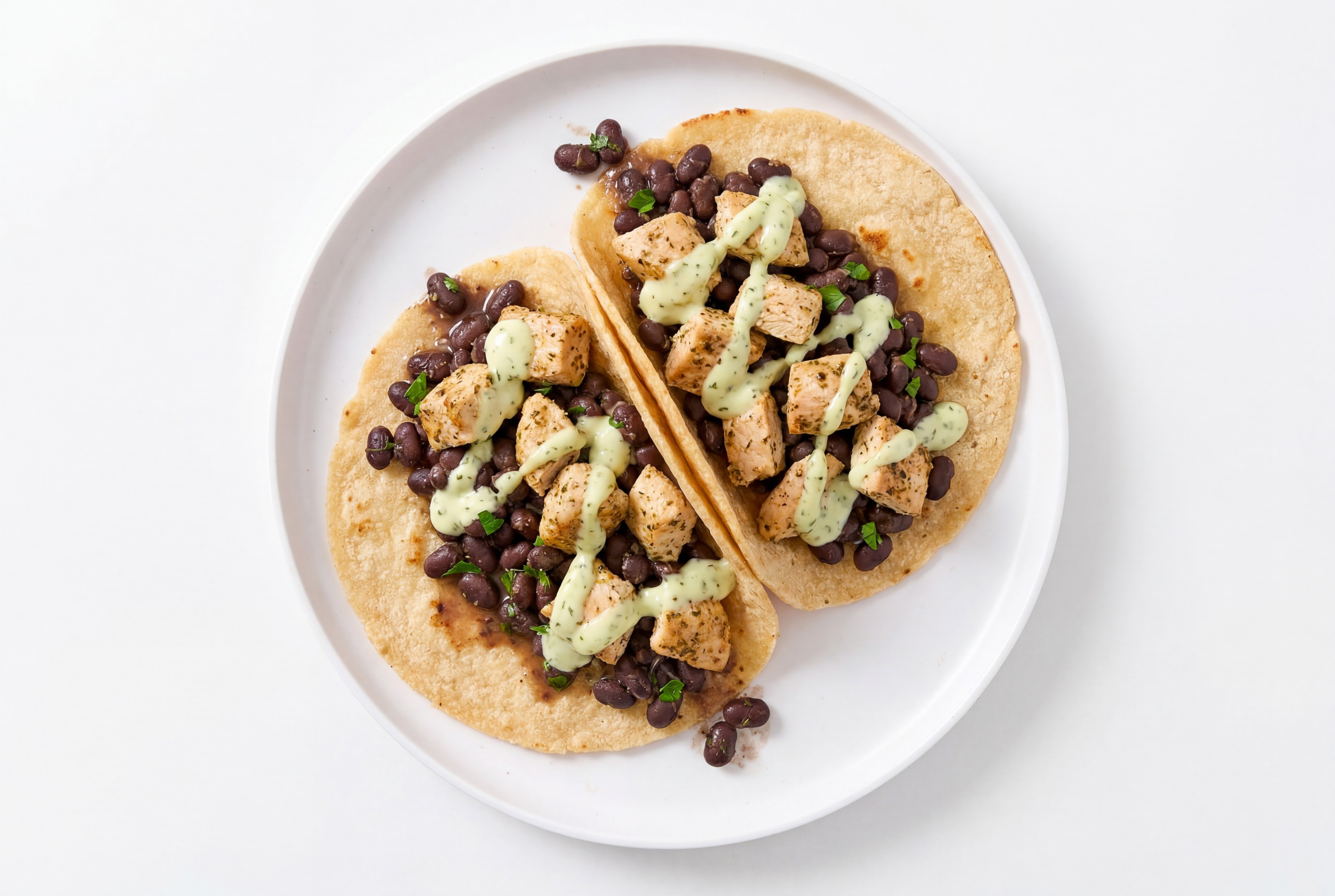 Garlic Chicken Tacos with Jalapeño Crema & Spiced Beans