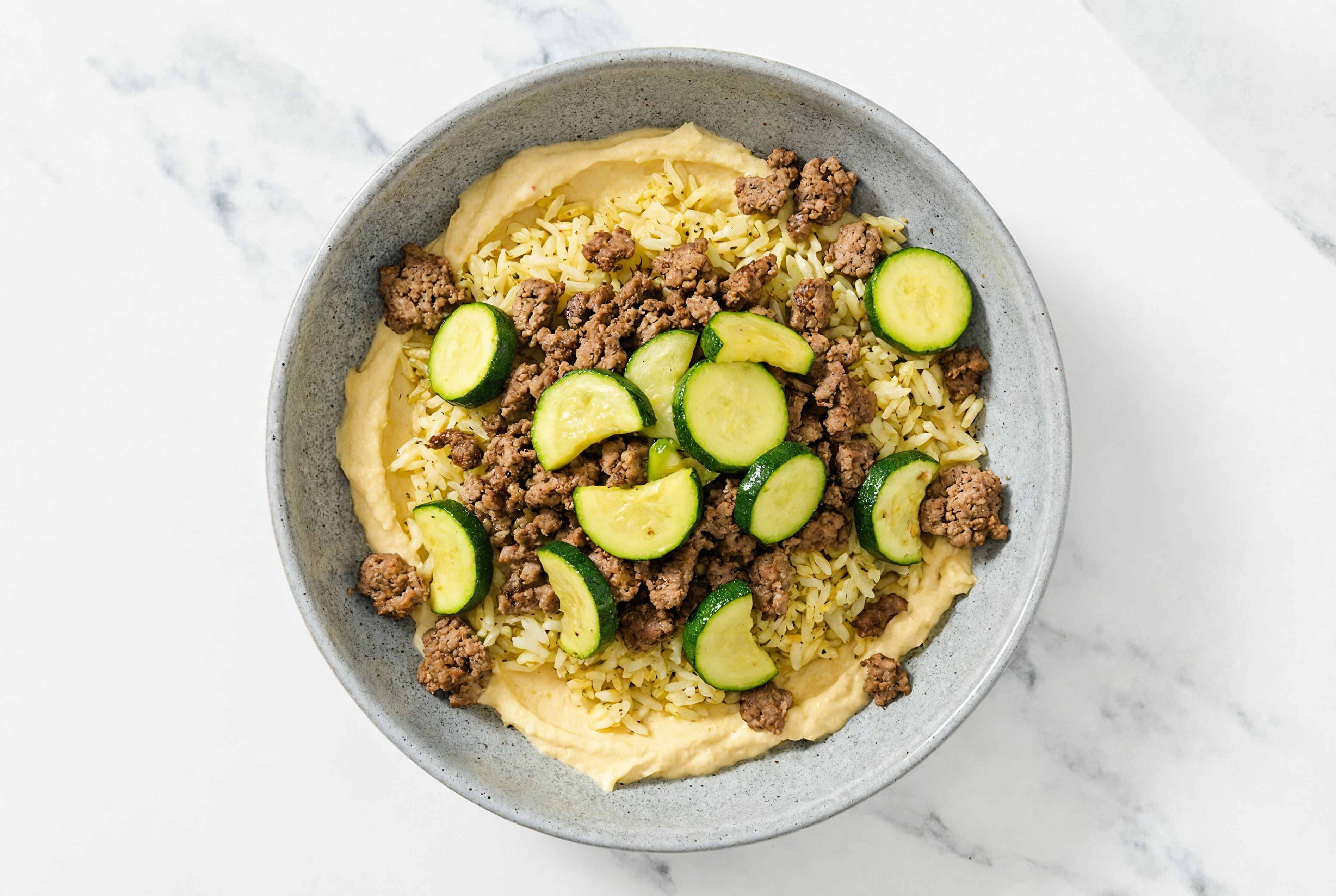 Ground Bison & Zucchini Grain Bowl with Lemon Garlic Hummus