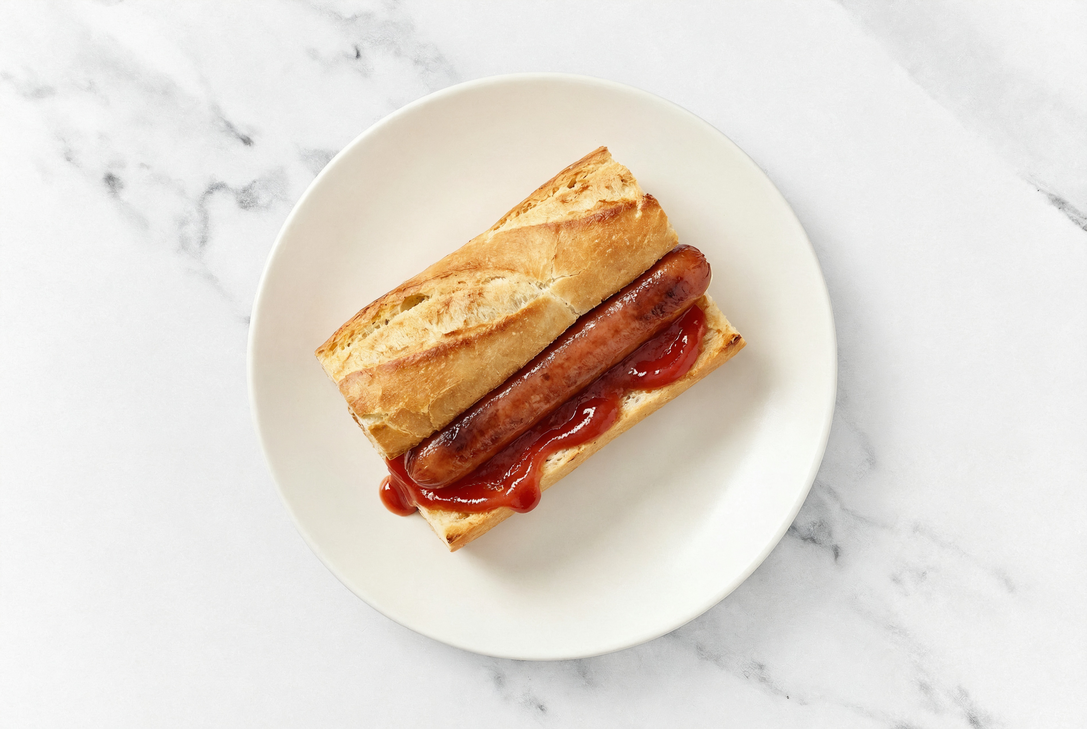 Beef Hot Dog with Ketchup on Baguette
