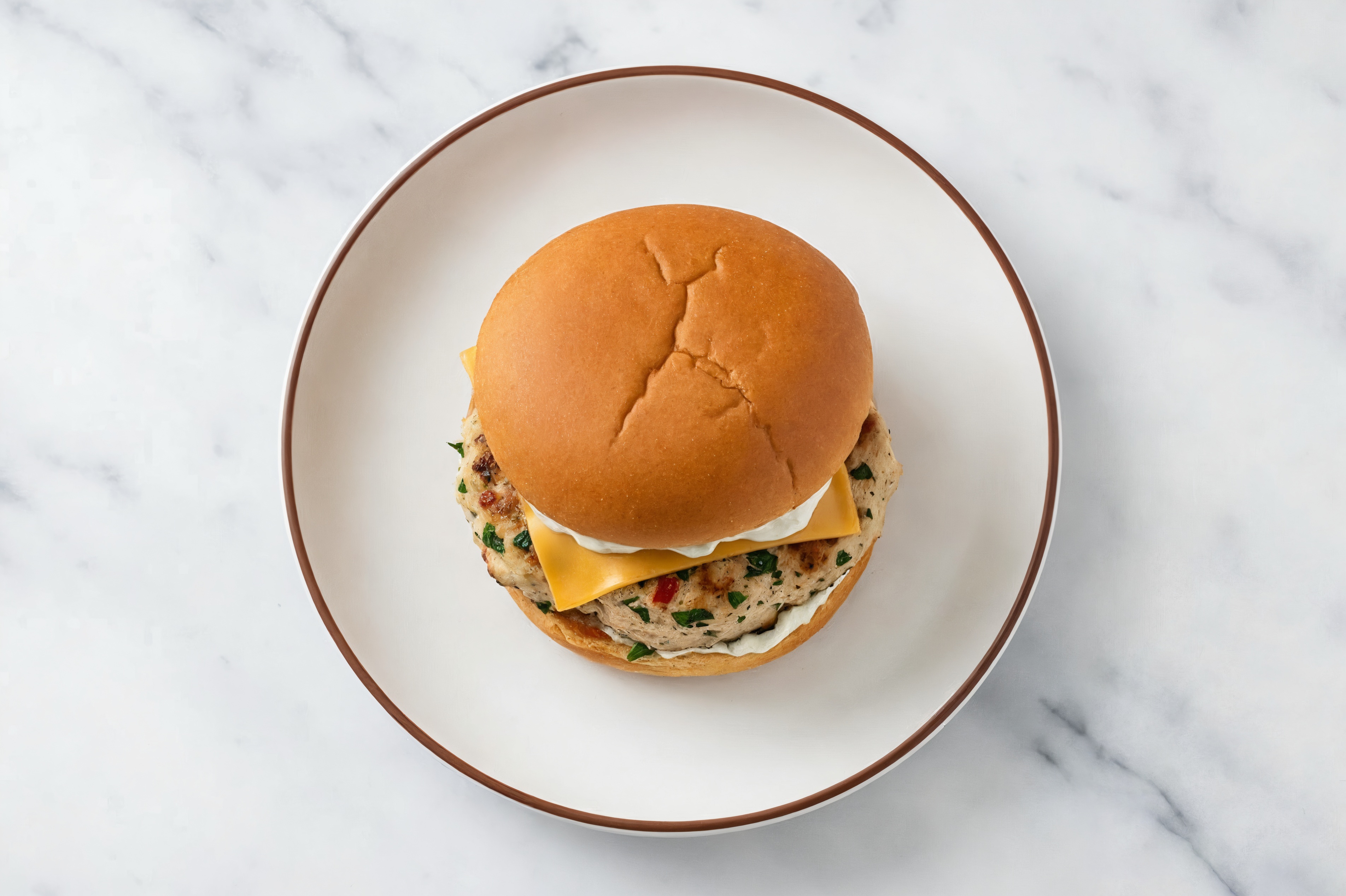 Garlic Chicken Burger on Gluten-Free Bun with Tzatziki & Gouda
