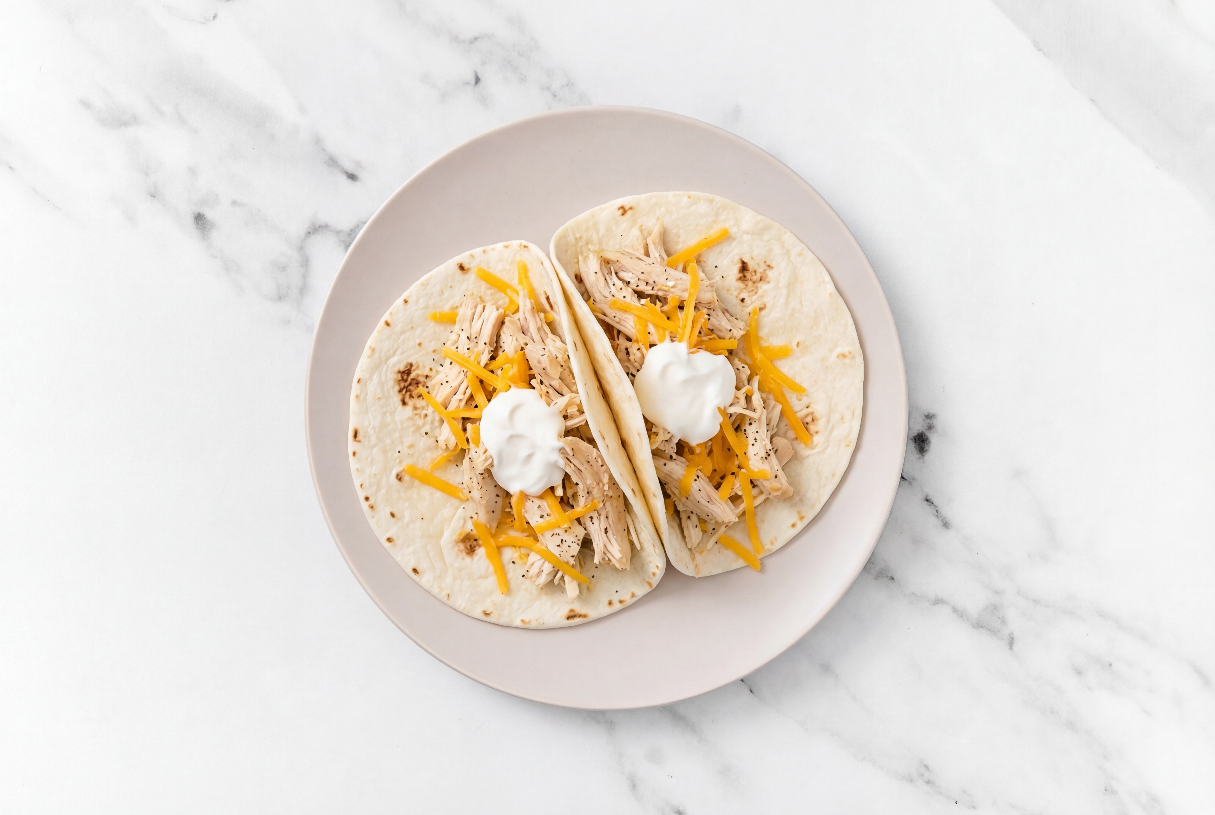 Pulled Chicken Taco with Sour Cream and Cheese