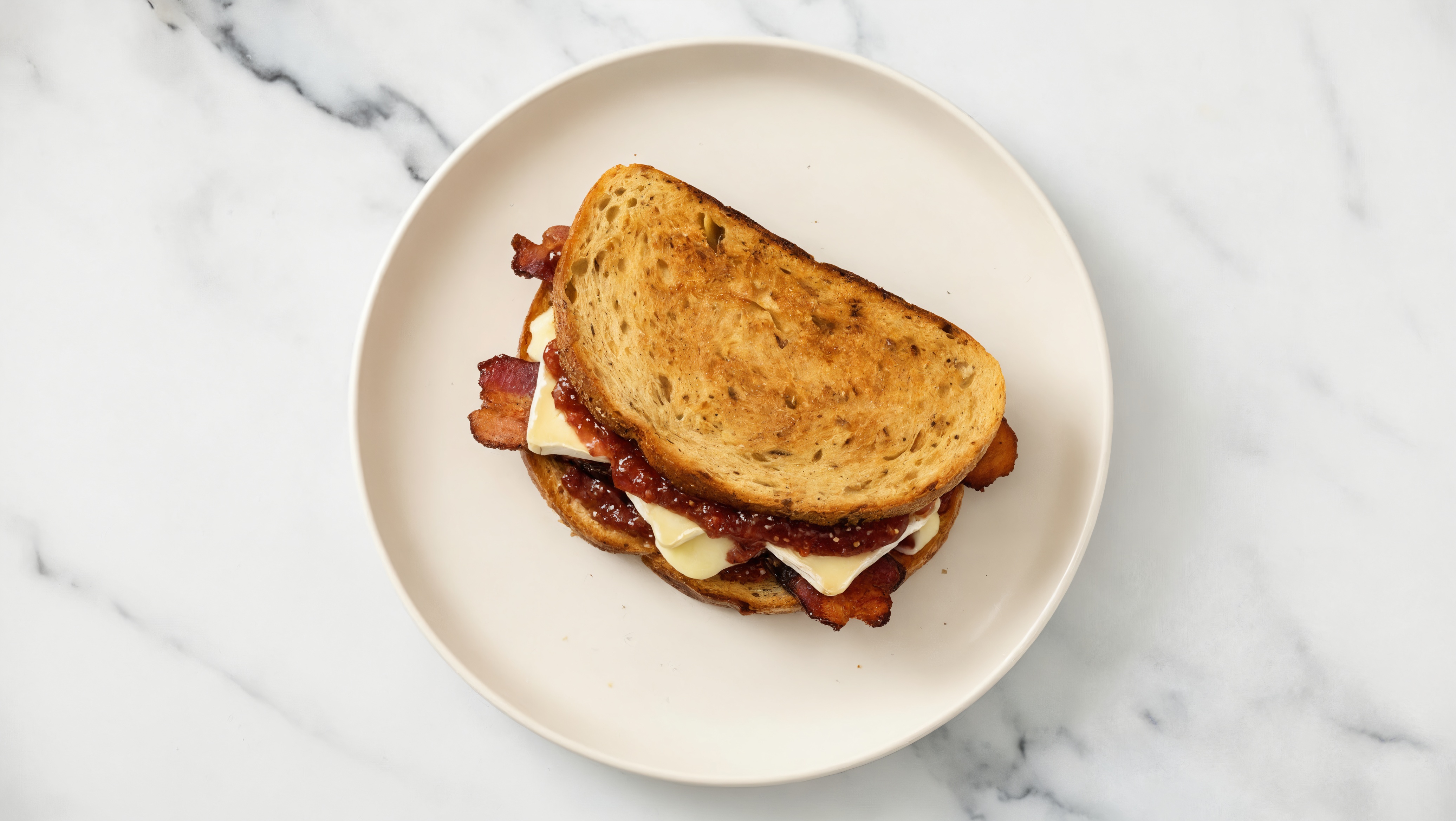 Maple Bacon, Brie + Strawberry Jam Multgrain Sourdough Grilled Cheese