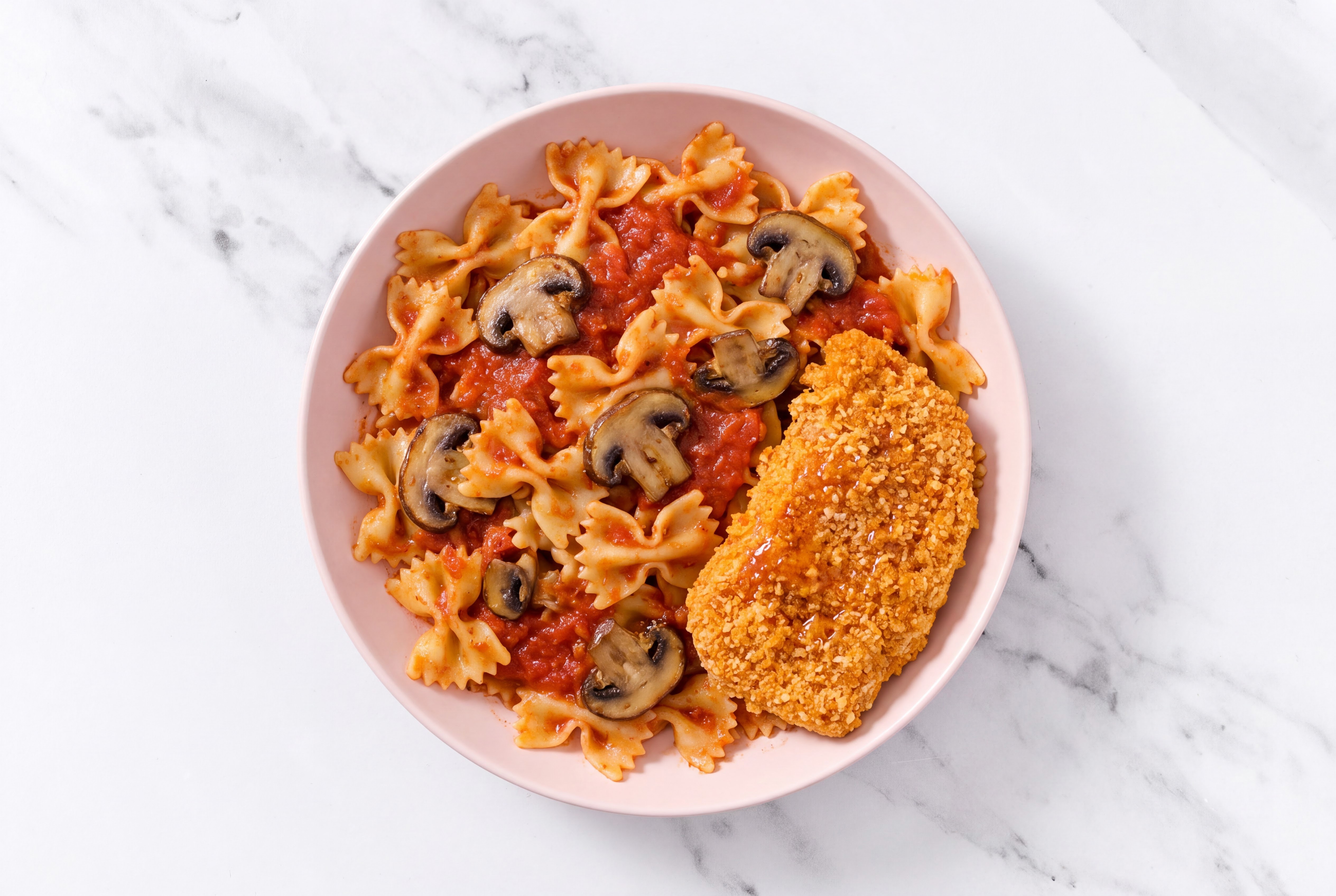 Crispy Hot Honey Chicken over Marinara Farfalle with Baby Bella Mushrooms