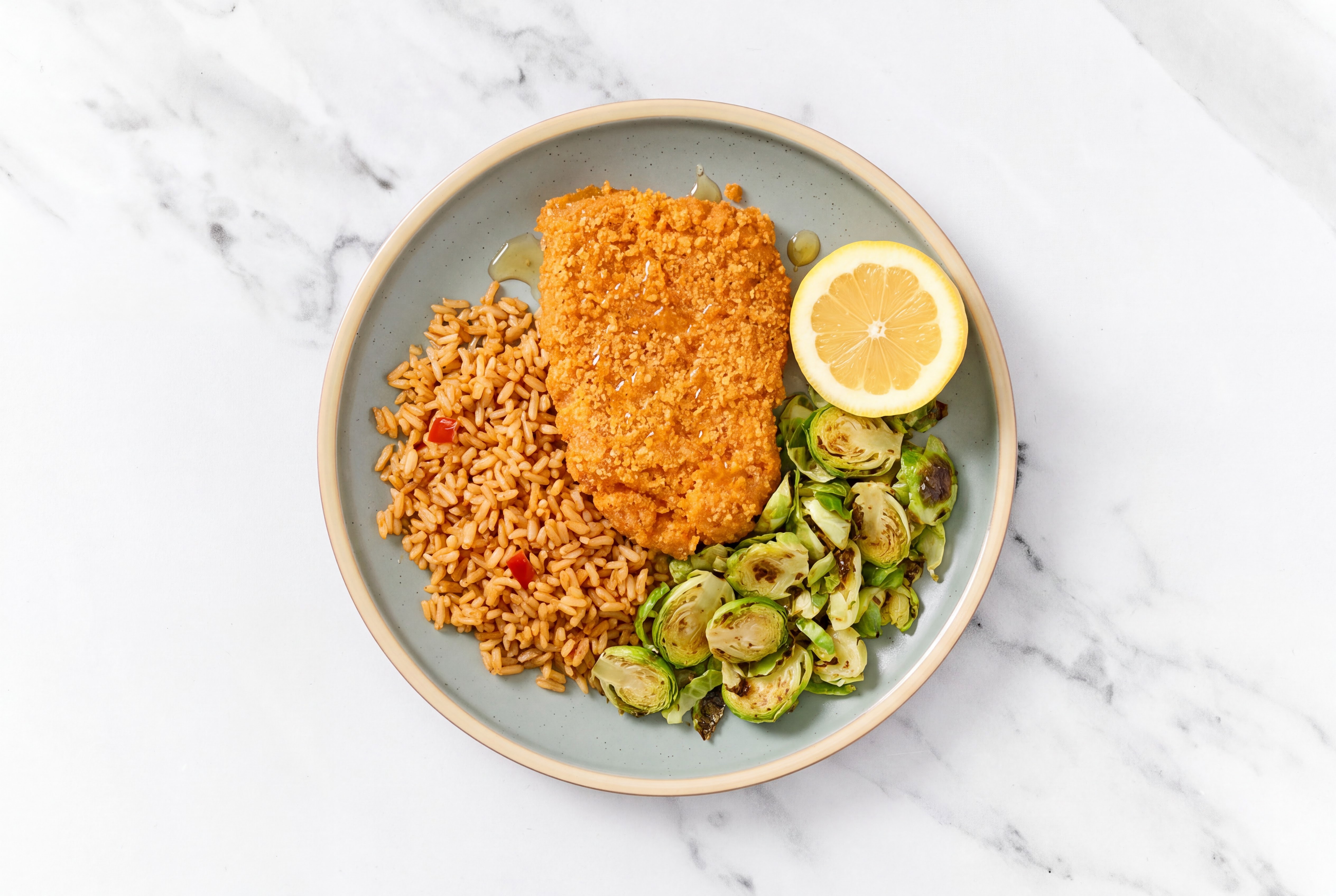 Lemon Hot Honey Breaded Chicken Cutlet with Brussels Sprouts & Mexican Rice