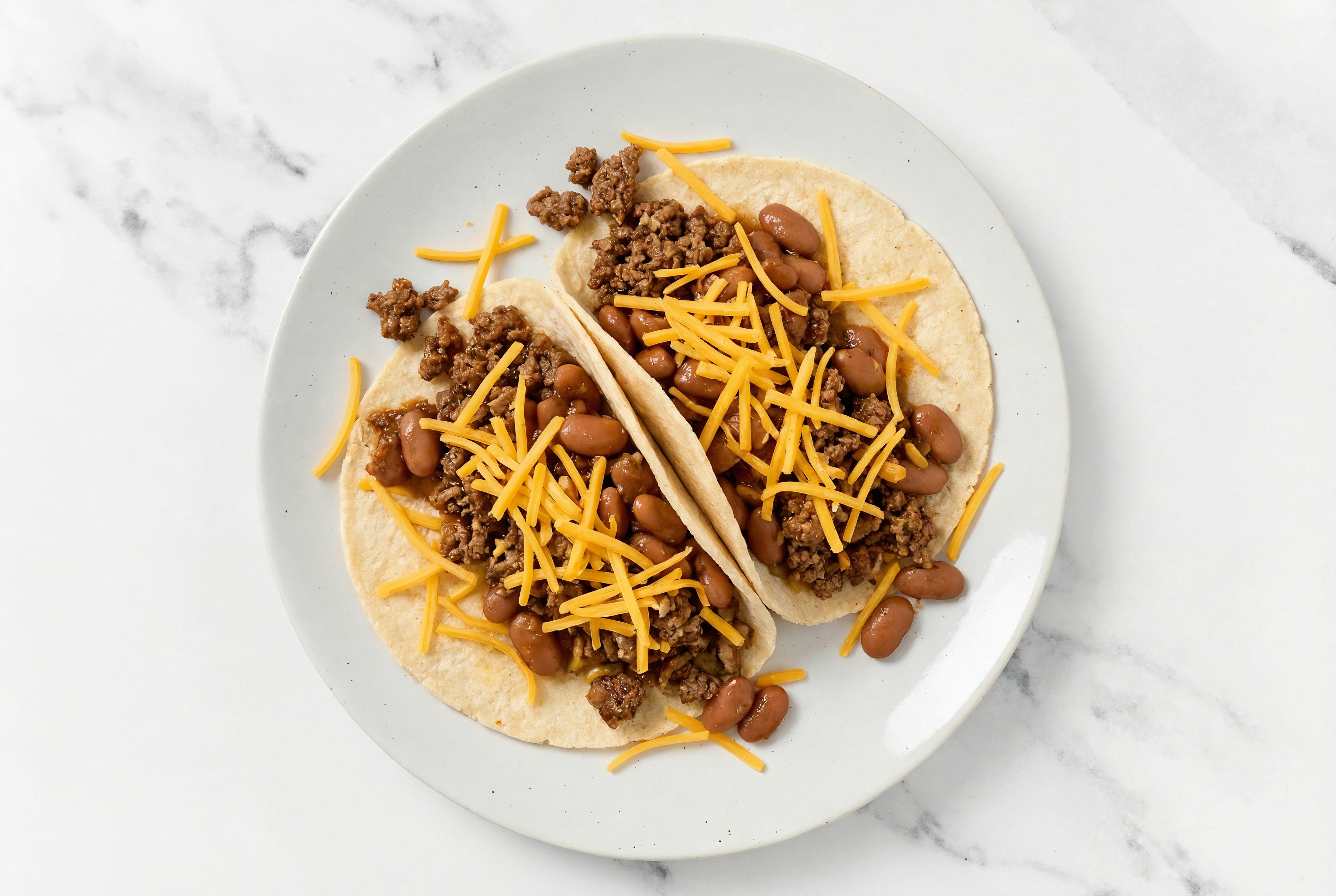 Mexican-Style Ground Beef Tacos with Cheddar Cheese & Pinto Beans