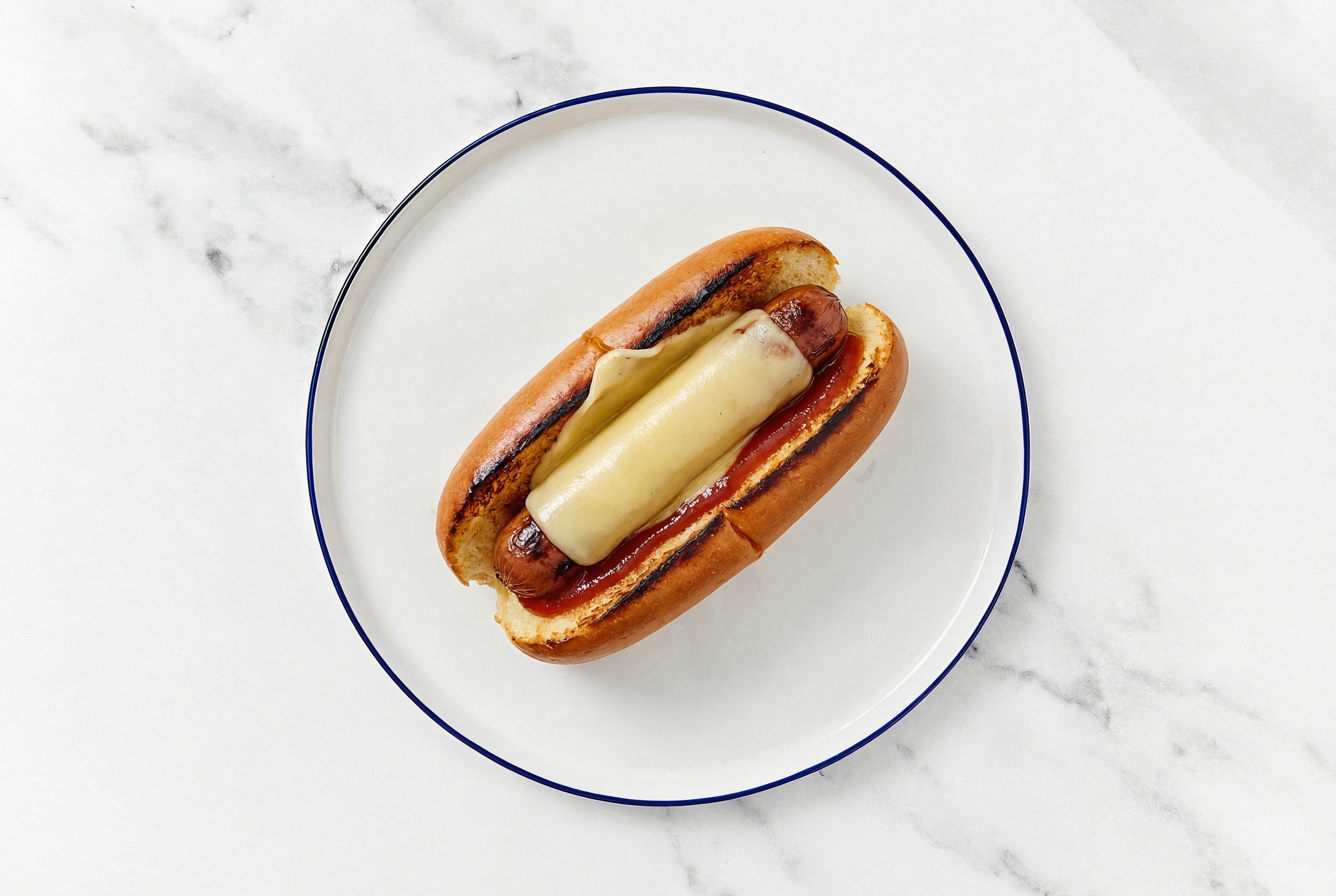 Vegan Cheddar Beef Hot Dog with Ketchup on Brioche