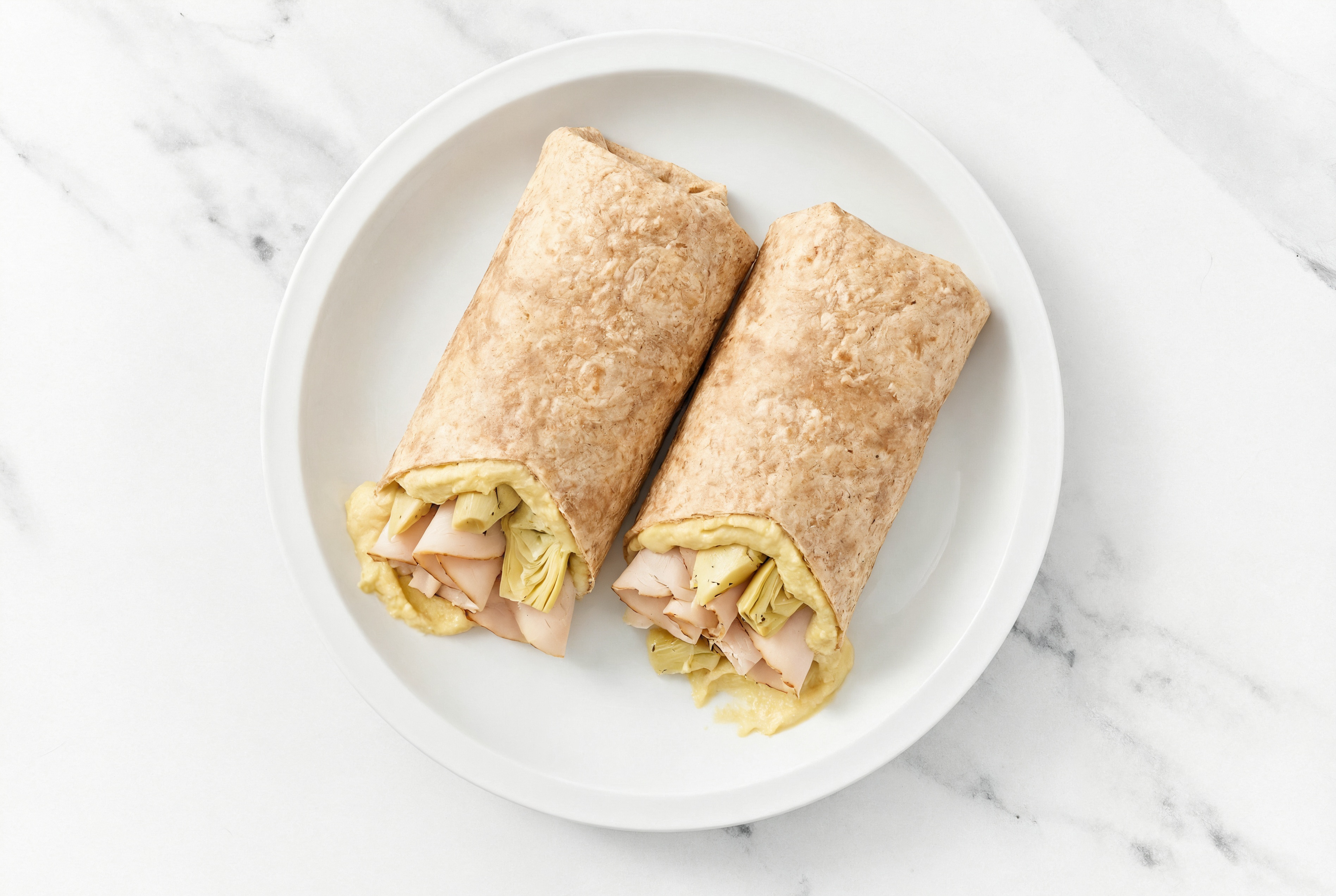 Hearty Mediterranean-Inspired Oven-Roasted Sliced Turkey Breast + Lemon Garlic Hummus Wrap