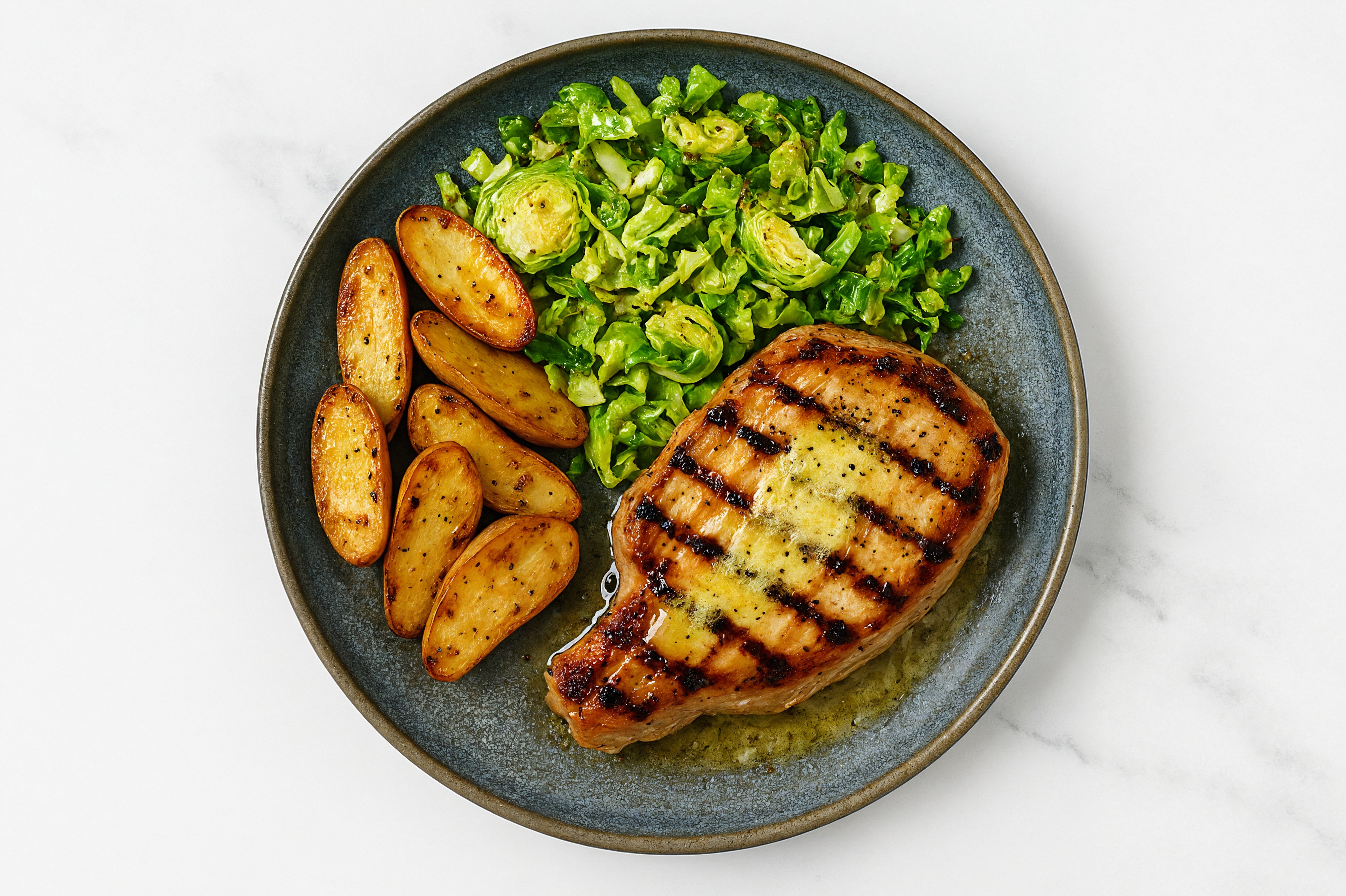 Lemon-Slow Churned & Peppercorn Pasture Butter Pork Chops with Fingerling Potatoes & Brussels