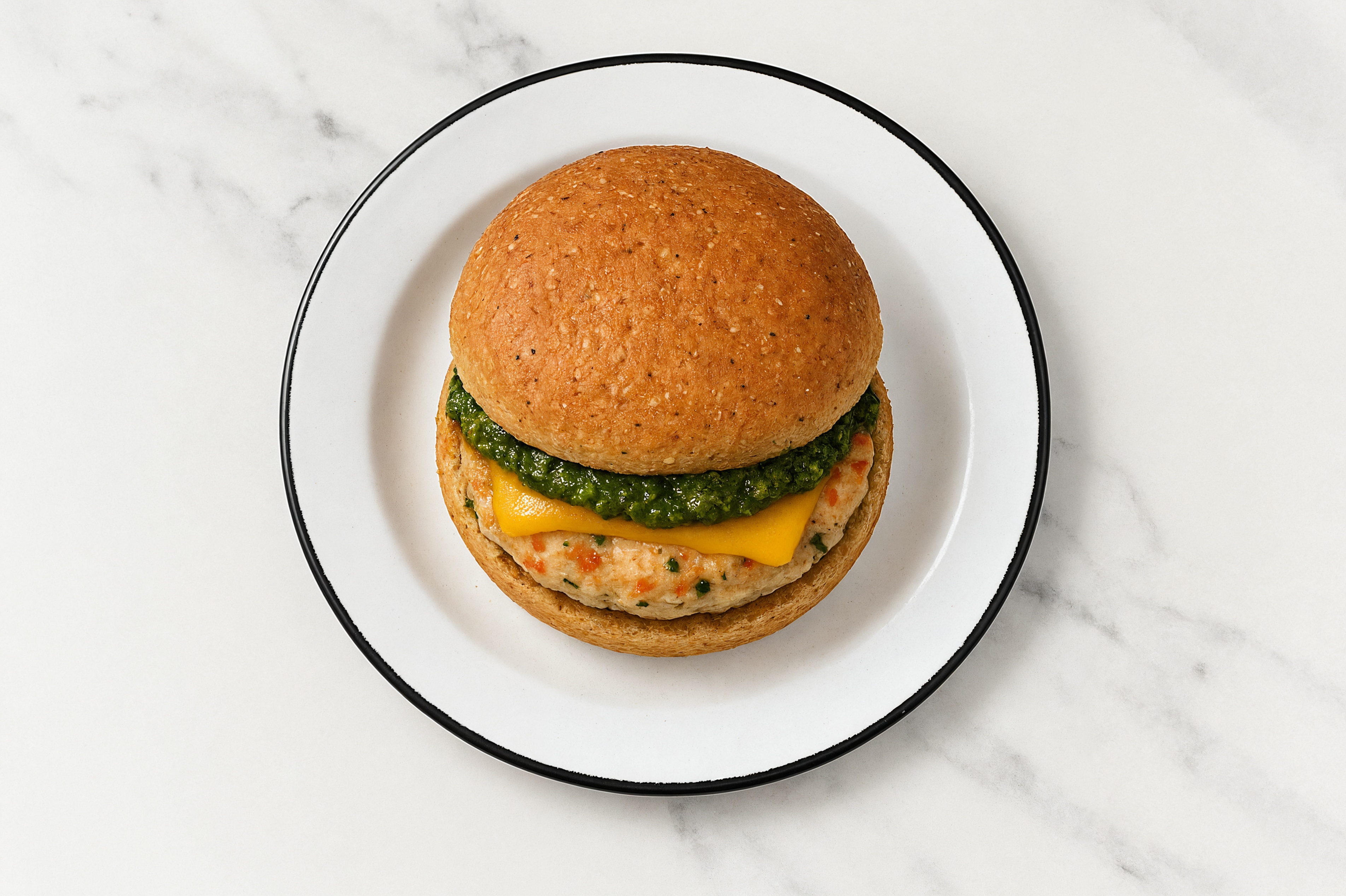 Garlic Chicken Burger on Sprouted Grain with Spinach Pesto & Cheddar
