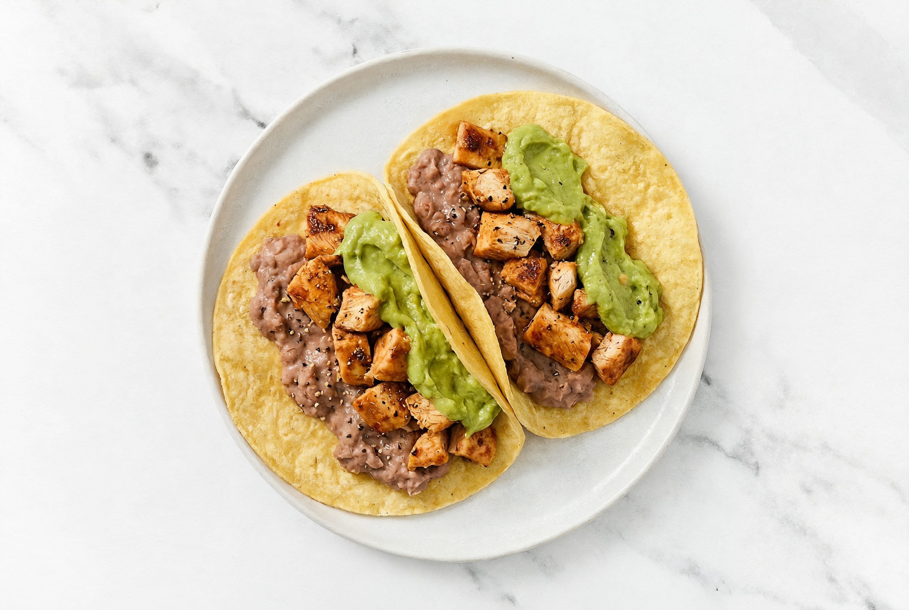 Herby Chipotle Chicken Tacos with Guacamole & Refried Red Beans