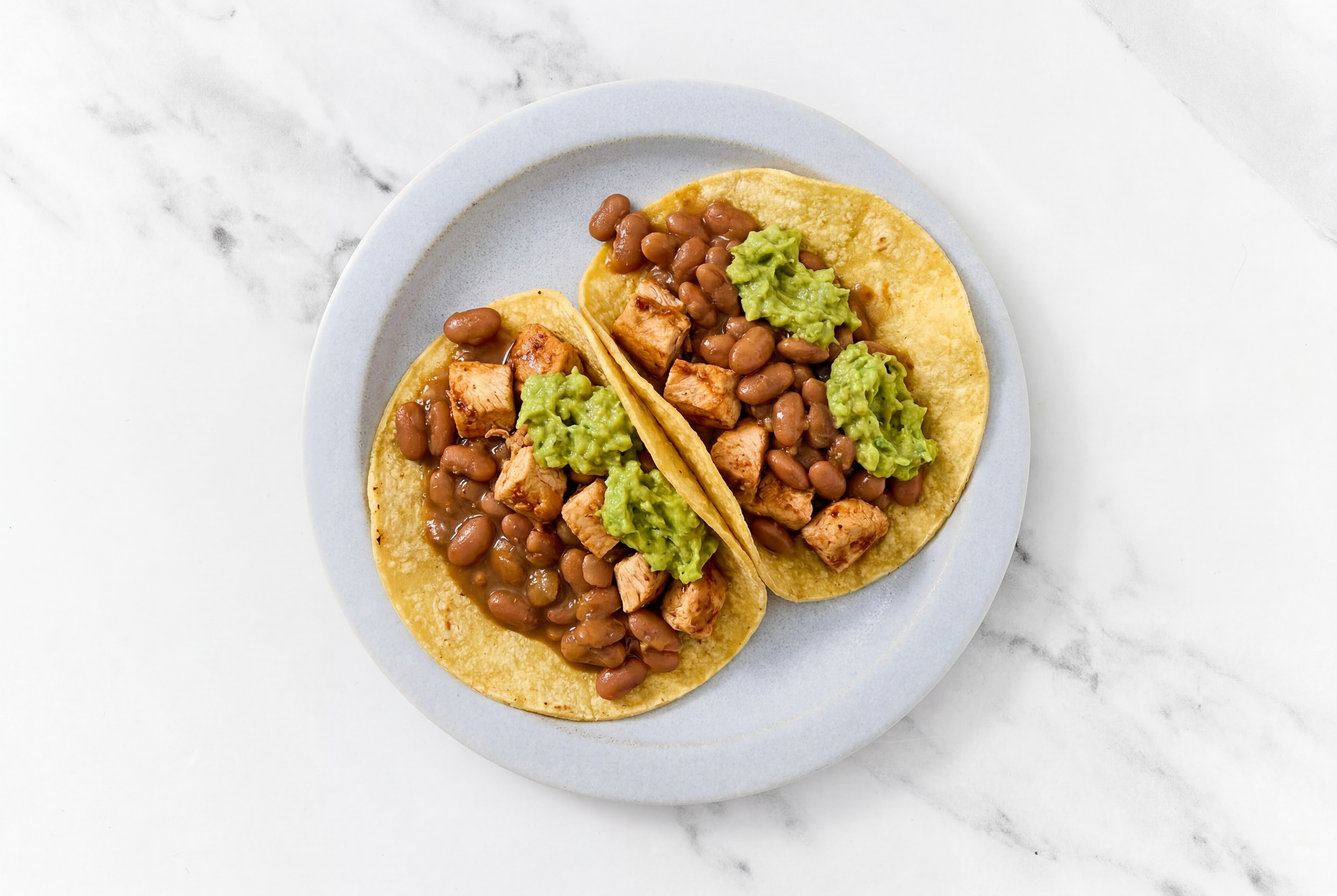 Herby Chipotle Chicken Tacos with Guacamole & Pinto Beans