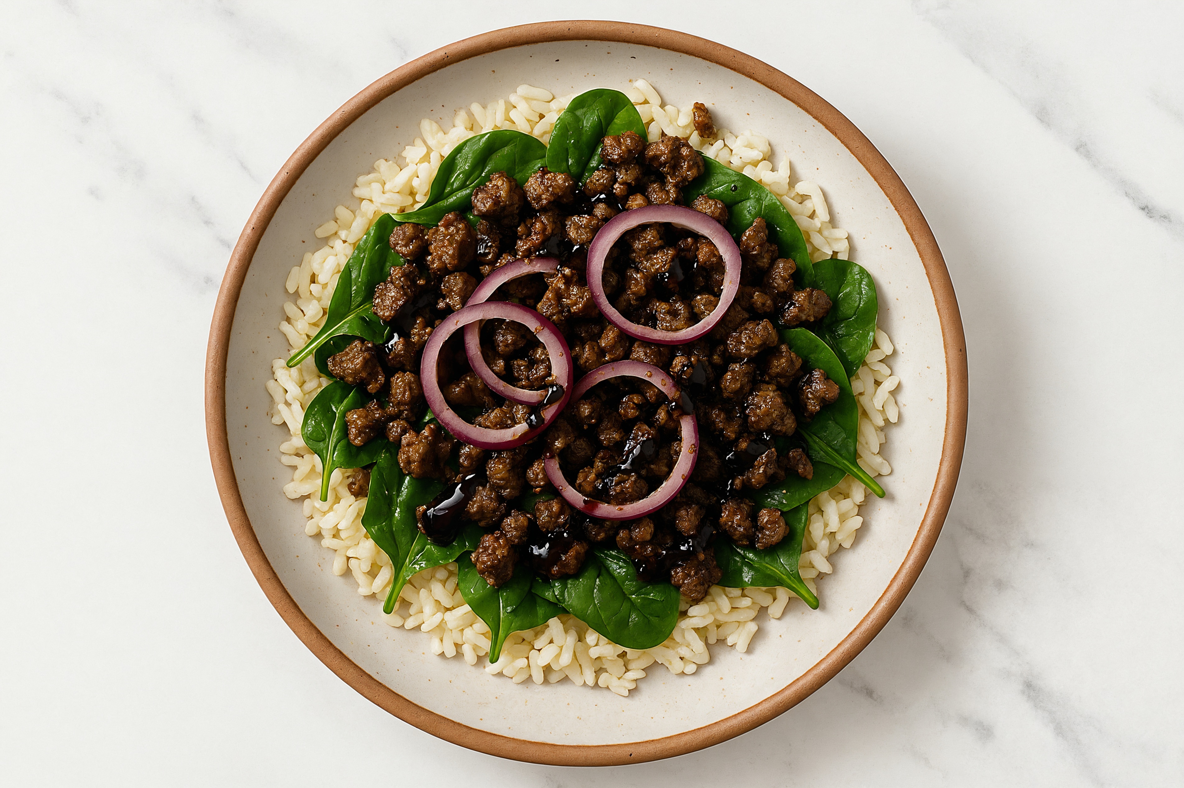 Ground Beef Patties, Pepper + Garlic Seasoning, Baby Spinach, Red Onion, Rice, Balsamic Vinegar