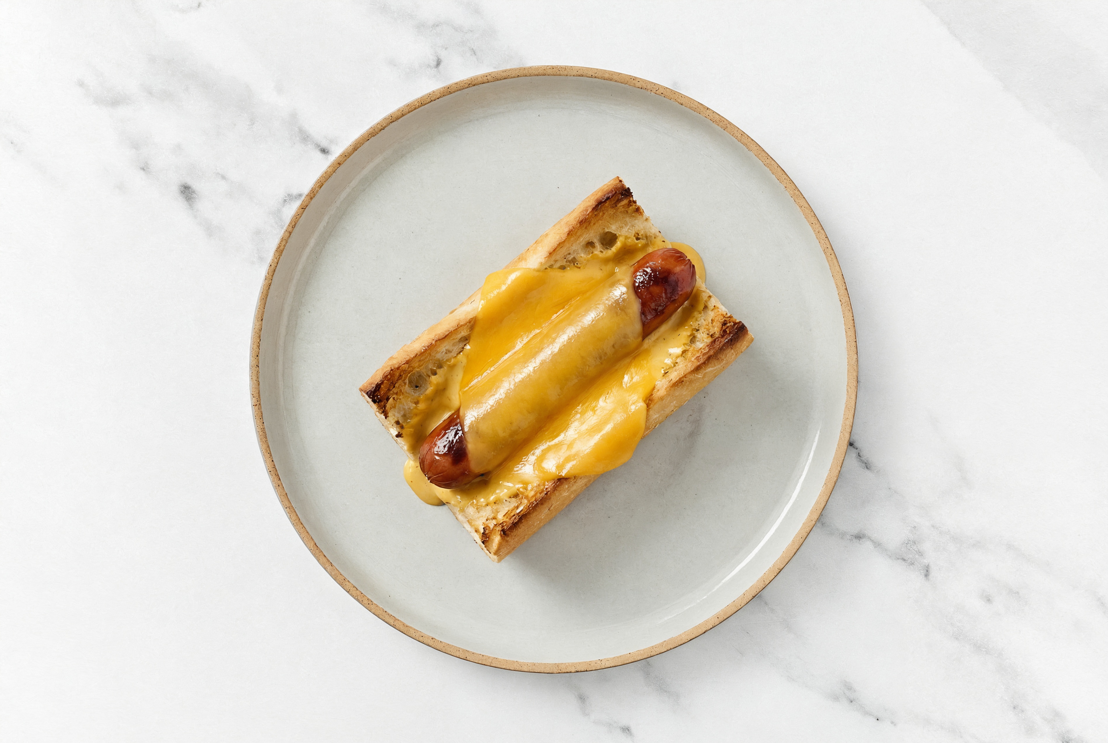 Cheddar Beef Hot Dog with Super Special Sauce on Baguette