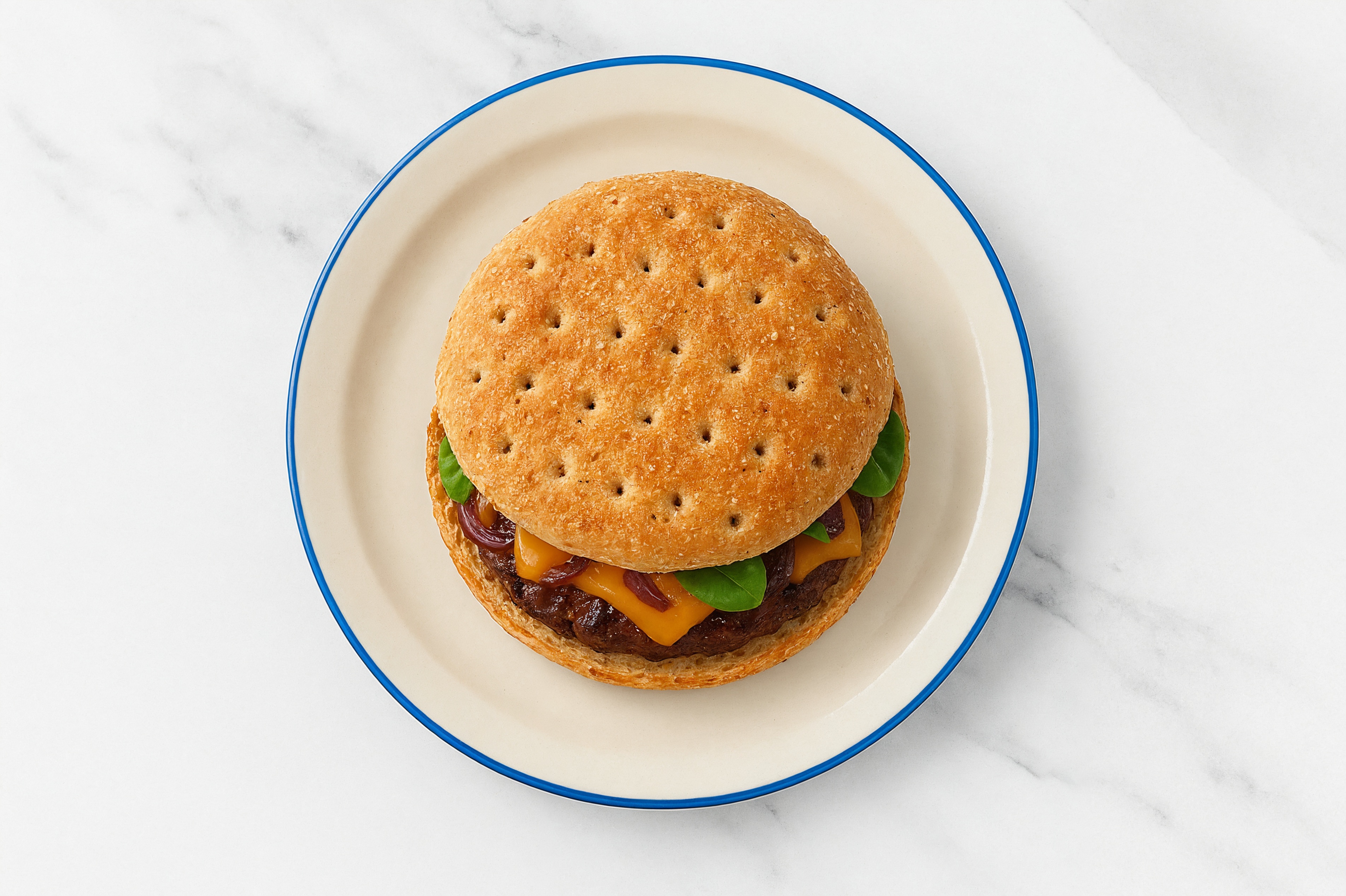 Juicy Caramelized Onion Cheeseburger on Multigrain with Baby Spinach